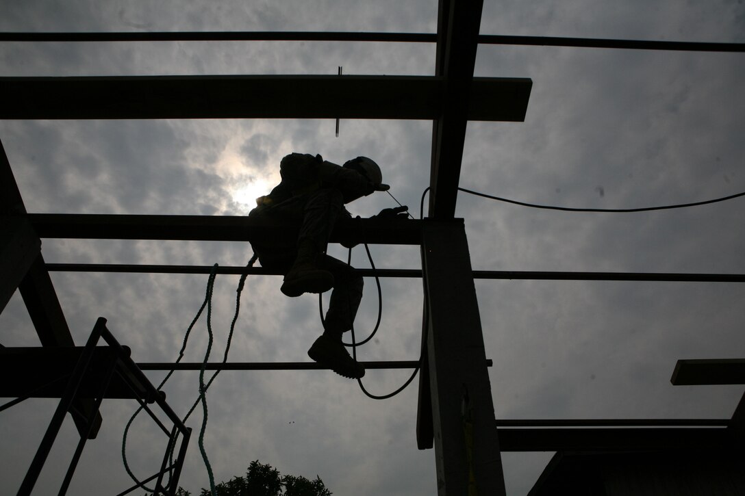 A U.S. soldier welds parts of the roof during construction of a new building at Ban Hua Wang Krang School, Muang District, Phitsanulok province, Kingdom of Thailand, Feb. 2. Four similar structures are being built throughout the Kingdom of Thailand during ongoing engineering civic assistance projects part of Exercise Cobra Gold 2013.U.S. involvement in CG 13 demonstrates commitment to building military-to-military interoperability with participating nations and to supporting peace and stability throughout the region. The U.S. soldier is with the 643rd Engineer Company (Vertical), 84th Engineer Battalion, 130th Engineer Brigade, Schofield Barracks, Hawaii.
