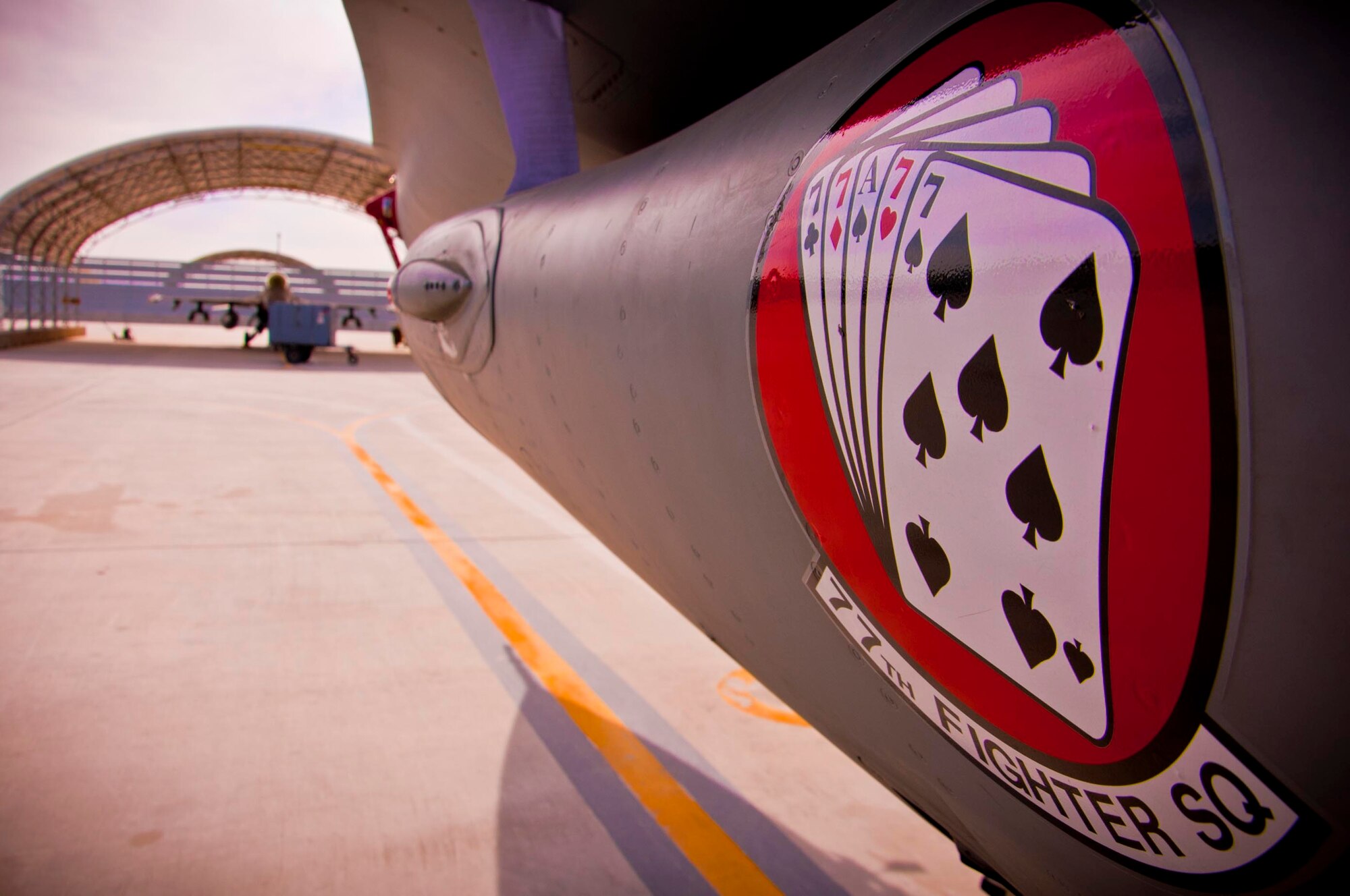 KANDAHAR AIRFIELD, Afghanistan – An F-16 Fighting Falcon deployed from 77th Fighter Squadron at Shaw Air Force Base, S.C., sits idle before a weapons load competition takes place here Feb. 11. A three-man weapons load crew representing the 77th Gambler Aircraft Maintenance Unit completed a four-phase evaluation. Their overall score will be put up against other scores of weapons load crews from their home station, Shaw Air Force Base, S.C. (U.S. Air Force photo/Senior Airman Scott Saldukas)