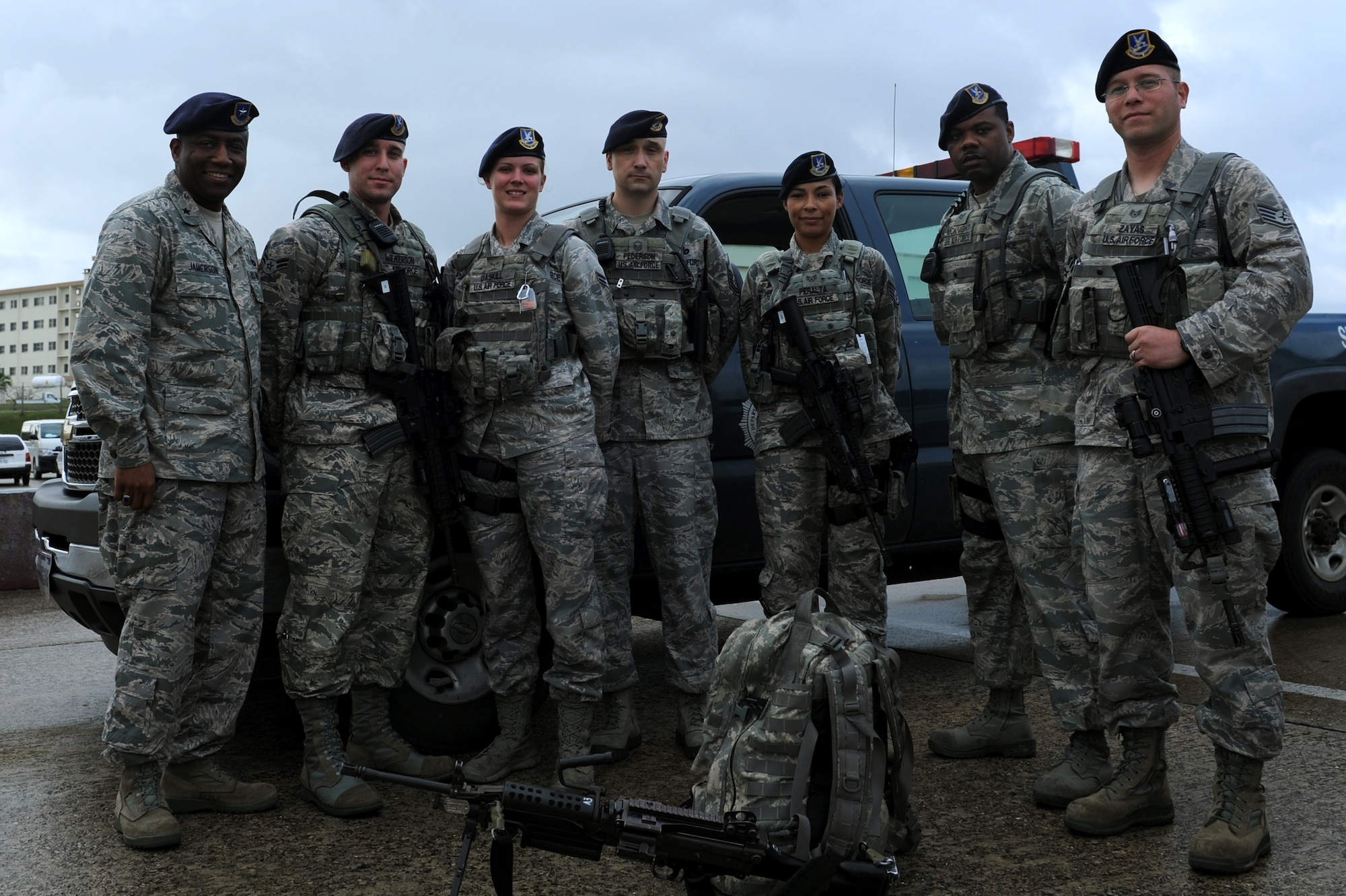 U.S. Air Force Brig. Gen. Allen Jamerson, Director of Security Forces, Deputy Chief of Staff for Logistics, Installations and Mission Support, Headquarters U.S. Air Force, Washington, D.C., and 18th Security Forces Squadron members participate in a group photo during a visit on the flightline at Kadena Air Base, Japan, Feb. 12, 2013. Jamerson is the focal point for ensuring the physical security of Air Force nuclear assets, planning and programming for more than 37,000 active-duty and Reserve component security forces at locations worldwide. (U.S. Air Force photo/Airman 1st Class Hailey R. Davis) 