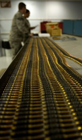 7.62 belted ammunition covers the table during an inspection by Staff Sgt. Corey York and Staff Sgt. Angel Smith, 57th Maintenance Squadron munitions systems craftsmen, Feb. 11, 2013, Nellis Air Force Base, Nev. All munitions must be inspected periodically to ensure serviceability and safety.  (U.S. Air Force photo by Tech. Sgt. Taylor Worley)