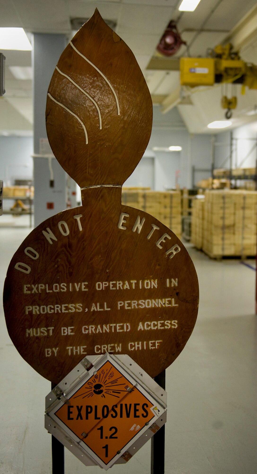 An explosive operation sign warns visitors upon entering the work bay at the 57th Maintenance Squadron inspection building Feb. 11, 2013, Nellis Air Force Base, Nev. (U.S. Air Force photo by Tech. Sgt. Taylor Worley)