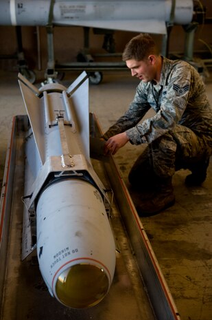 Senior Airman Joshua Schexnayder, a 57th Maintenance Squadron munitions systems journeyman, performs a post load inspection on an AGM-65 Feb. 7, 2013 at Nellis Air Force Base, Nev. Munitions that are flown but not launched must have a post load inspection to ensure serviceability prior to being loaded on another aircraft. (U.S. Air Force photo by Tech. Sgt. Taylor Worley)