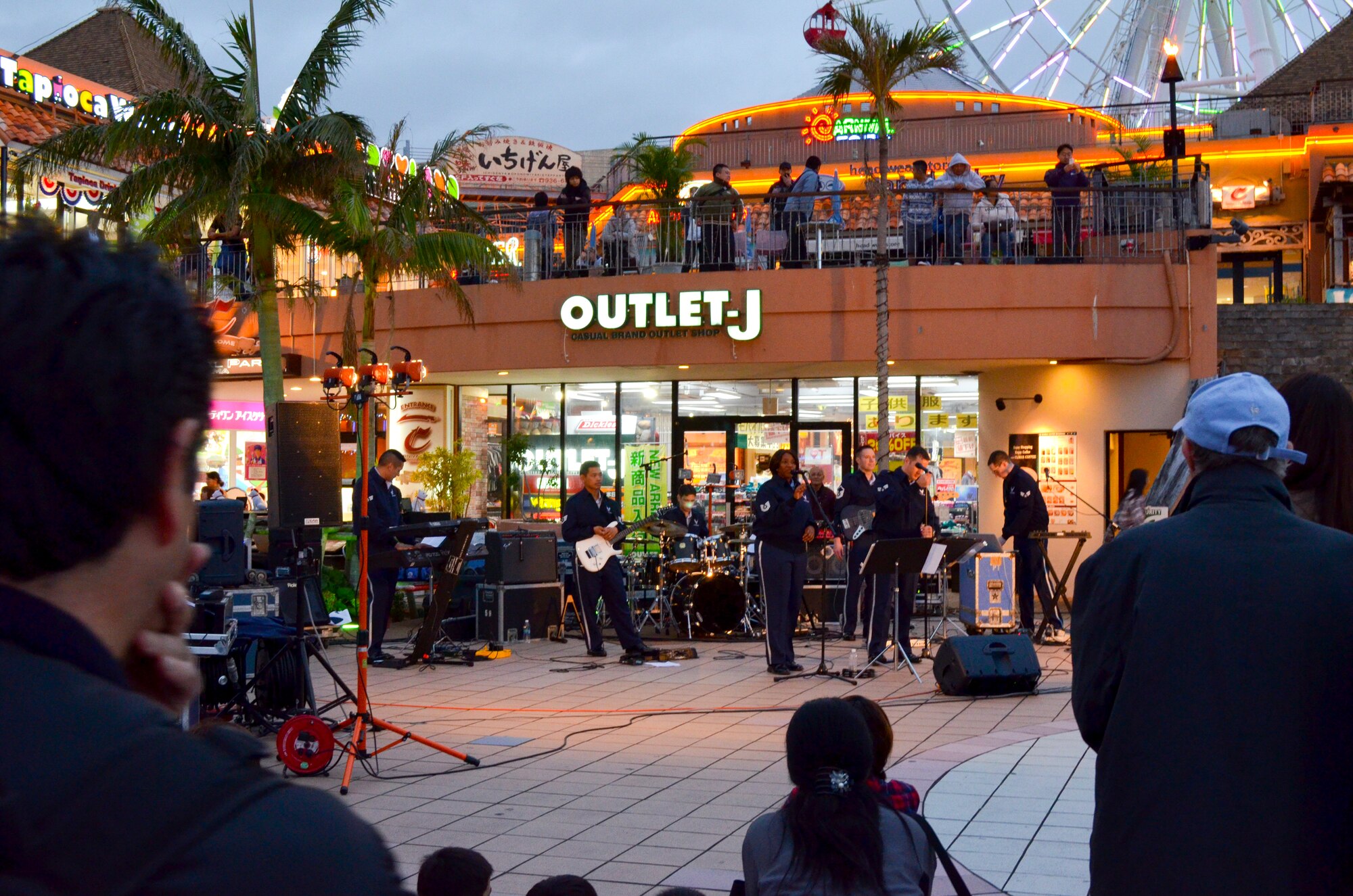 The Pacific Air Forces band, Pacific Trends, performs in American Village in Okinawa, Japan, Feb. 9, 2013. The band traveled around Okinawa performing hit songs from the 80s to today. (U.S. Air Force photo/Capt. Haley Armstrong)