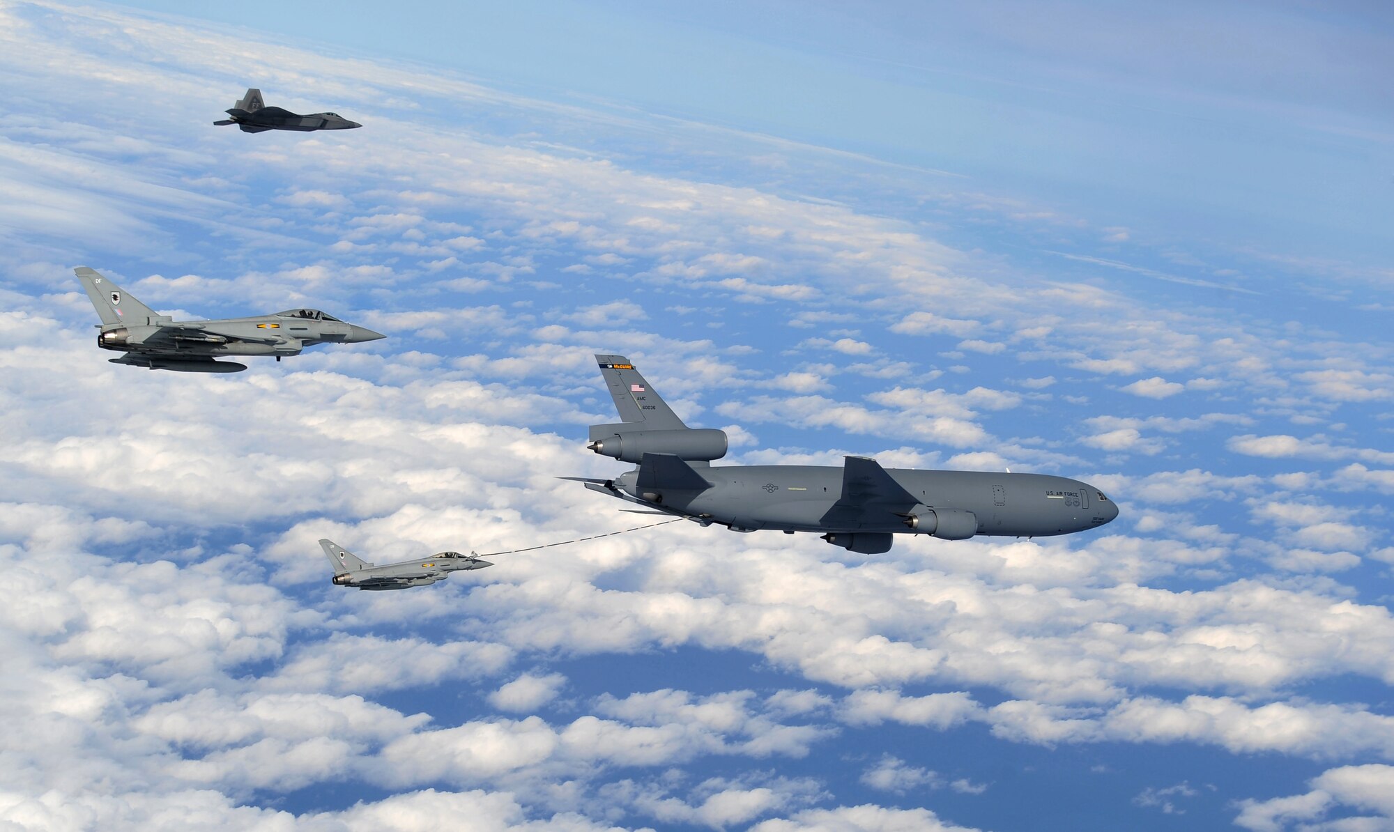 A U.S. Air Force KC-10 Extender assigned to the 305th Air Mobility Wing, Joint Base McGuire-Dix-Lakehurst, N.J., refuels two Royal Air Force Eurofighter Typhoon aircraft and a U.S. Air Force F-22 Raptor during exercise RAZOR TALON on Seymour Johnson Air Force Base, N.C., Feb. 7, 2013. RAZOR TALON is a monthly, large force exercise and joint-unit training opportunity to employ cutting edge operational concepts such as AirSea and Maritime Air Support on the Atlantic Coast. (U.S. Air Force photo by Staff Sgt. Andy M. Kin)
