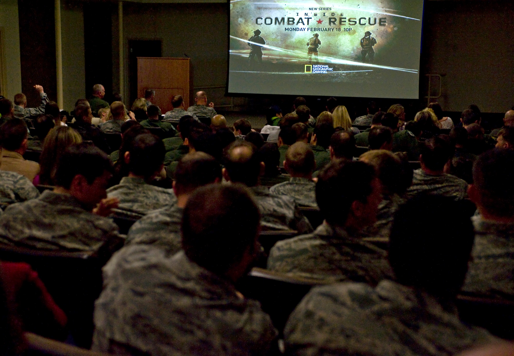 Members of the 58th Rescue Squadron, 66th Rescue Squadron, and their families attend the premiere of National Geographic Channel's 'Inside Combat Rescue' Feb. 8, 2013, at Nellis Air Force Base, Nev.  Airmen from both squadrons will appear in the six part series starting Feb. 18, 2013. (U.S. Air Force photo by Senior Airman Matthew Lancaster)



