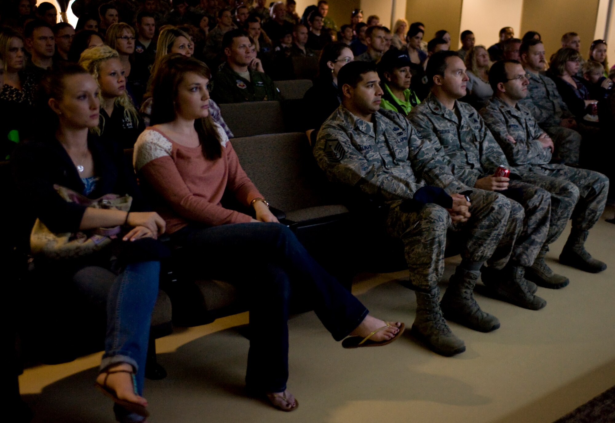 Members of the 58th Rescue Squadron, 66th Rescue Squadron, and their families watch the first episode of 'Inside Combat Rescue' during the premiere Feb. 8, 2013, at Nellis Air Force Base, Nev.  ?Inside Combat Rescue? is the National Geographic Channel?s exclusive documentary about Air Force pararescue missions in Afghanistan. (U.S. Air Force photo by Senior Airman Matthew Lancaster)


