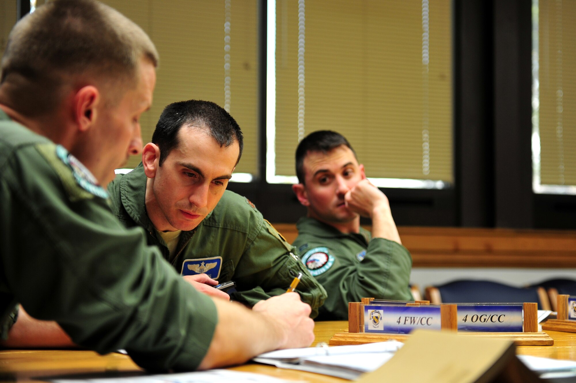 (Left to Right) U.S. Air Force Majs. Kyle Meyer, 335th Fighter Squadron assistant director of operations, Ronen Segal, 4th Operations Support Squadron chief of fighter scheduling, and Capt. Joseph Stenger, 335th FS weapons and tactics officer, go over training objectives during a mass aircrew brief during exercise RAZOR TALON at Seymour Johnson Air Force Base, N.C., Feb. 7, 2013. RAZOR TALON is a monthly, large force exercise and joint-unit training opportunity to employ cutting edge operational concepts on the Atlantic Coast. (U.S. Air Force photo by Staff Sgt. Andy M. Kin)