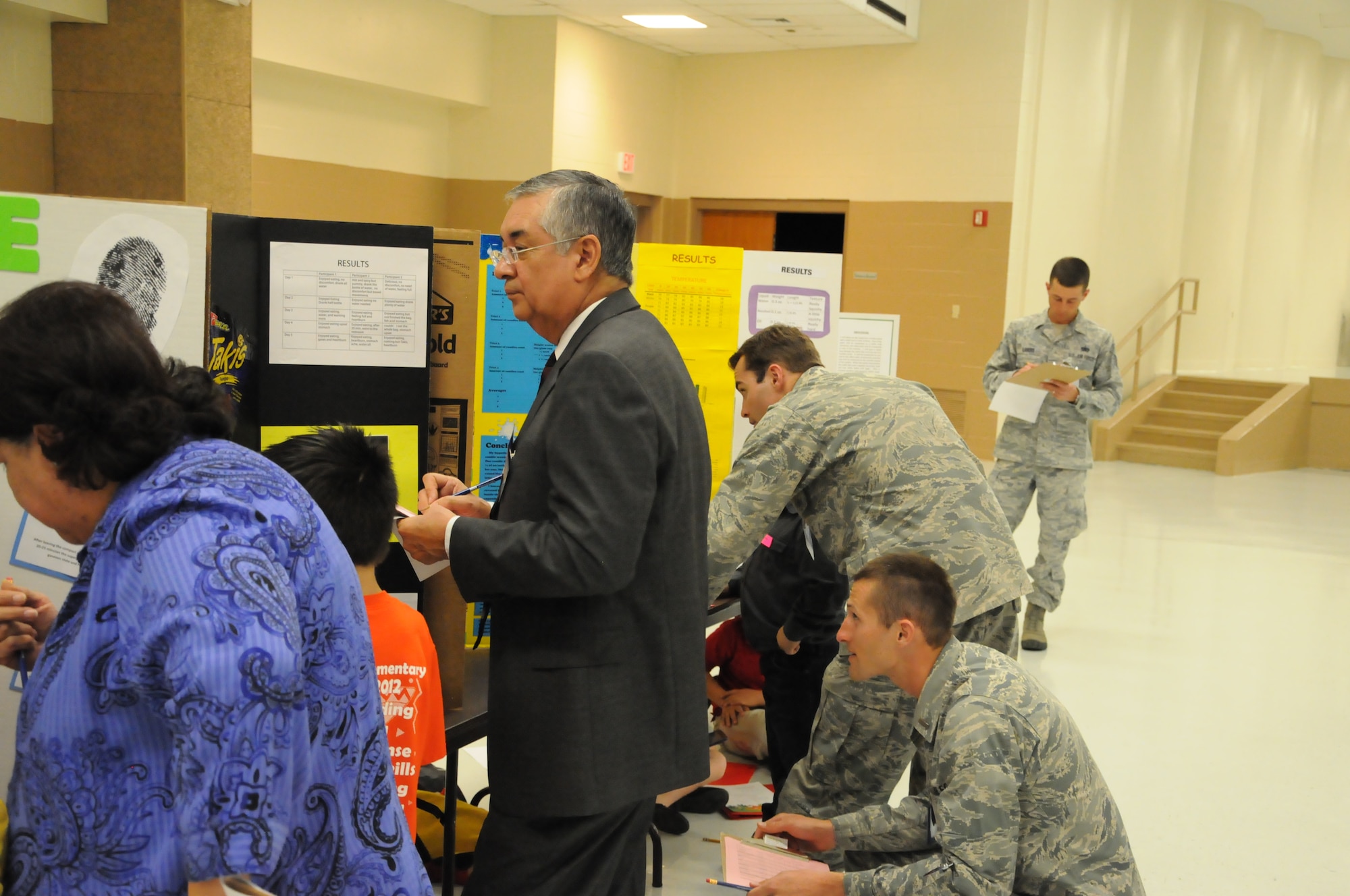 Mayor Roberto Fernandez, mayor of Del Rio, members of Team XL and Del Rio community members volunteered as judges for elementary schools at the district science fair at the Del Rio Civic Center Feb. 7, 2013. Volunteers from Laughlin made up more than half of the judges for the 148 science fair projects and 200 children participating in the San Felipe Del Rio Consolidated Independent School District, district science fair. (U.S. Air Force photo/2nd Lt. David Tart)