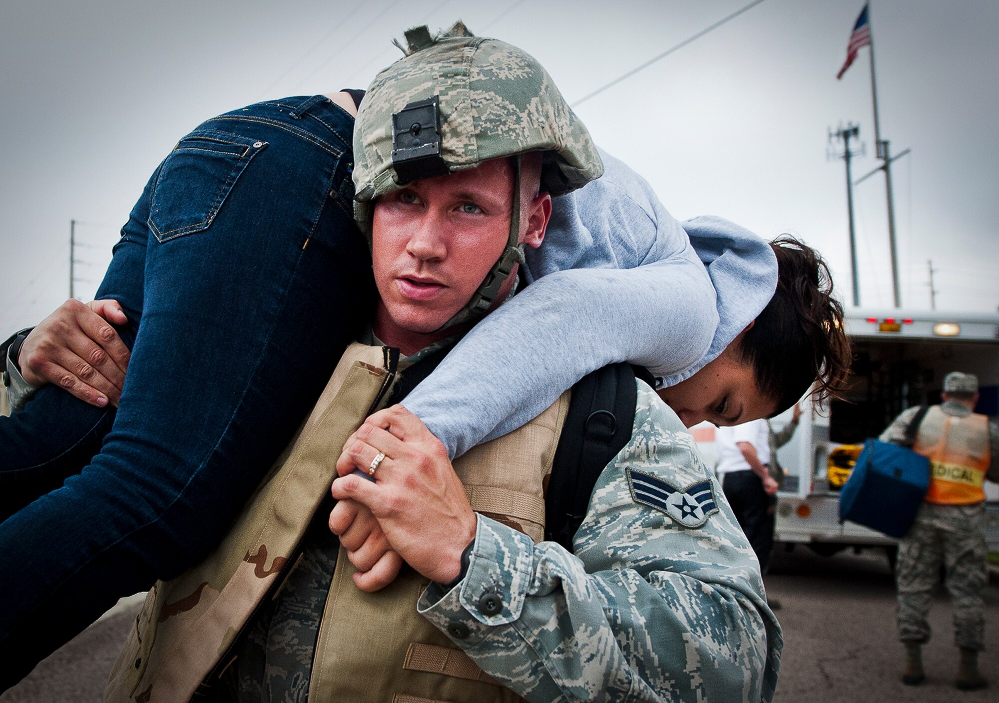 A 96th Security Forces Squadron Airman moves a victim to a safe location after a simulated bomb was found in the building during an active shooter exercise Wednesday, Feb. 6, 2013, at Eglin Air Force Base, Fla. The Airmen entered the building to apprehend the suspect, assess the wounded and report back information to the emergency responders. (U.S. Air Force photo/Samuel King Jr.)
