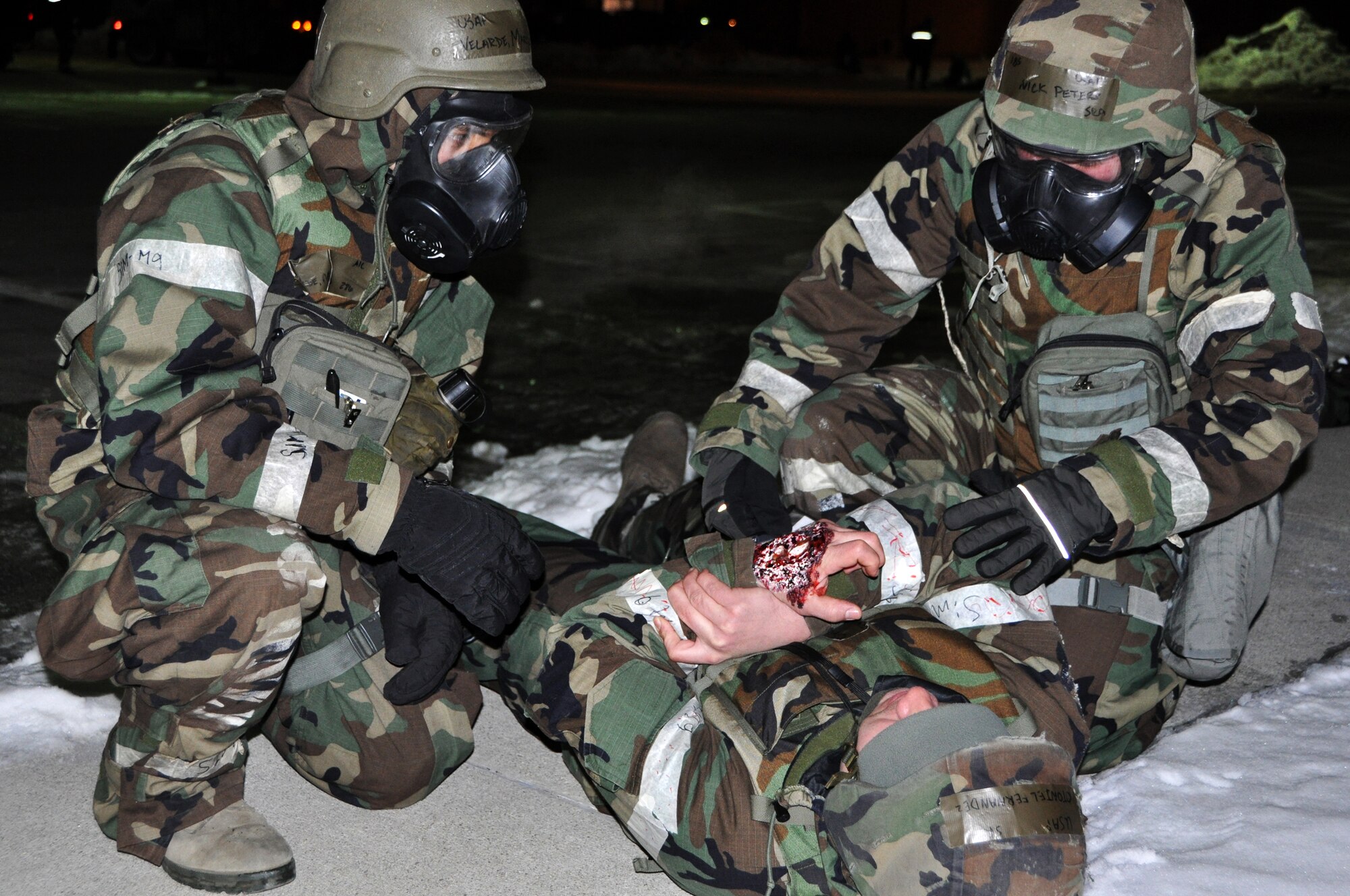 Airman 1st Class Marco Velardebanuelos and Senior Airman Nicholas Peters, 51st Civil Engineer Squadron explosive ordnance disposal members,  respond to a victim during a mass casualty simulation Feb. 13, 2013 for operational readiness exercise Beverly Bulldog 13-02 at Osan Air Base, Republic of Korea. Exercises like BB 13-02 allow the base to operate in heightened states of readiness to prepare for an upcoming inspection in April and real world contingencies.  