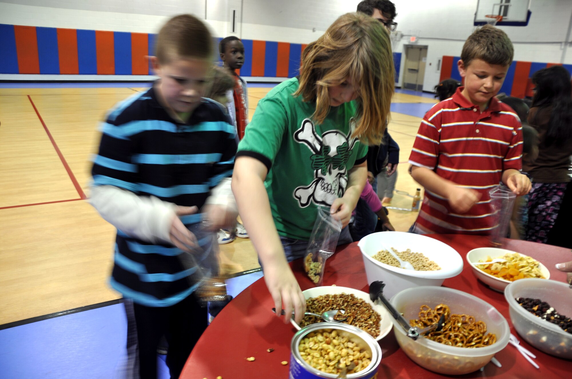 GOODFELLOW AIR FORCE BASE, Texas—Children create their own healthy snacks during the final station of the Kids’ Fun Day at the Youth Center Feb. 8. The annual event focuses on teaching youth life-long healthy fitness and nutritional habits. (U.S. Air Force photo/Airman Jessica Keith)  