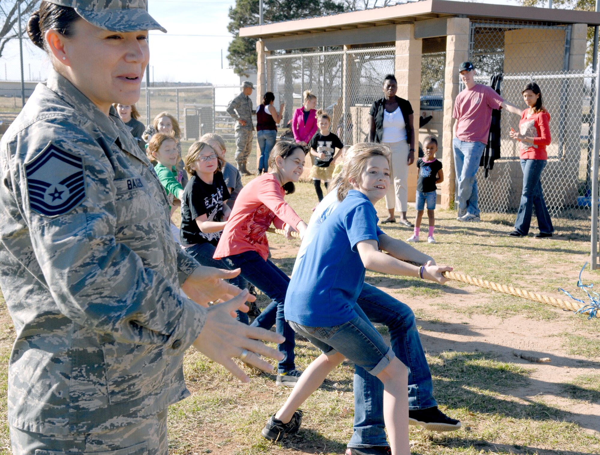 GOODFELLOW AIR FORCE BASE, Texas—Senior Master Sgt. Tarah Baxley, 17th Training Wing Airman Leadership School commandant, referees a tug-of-war competition during the fifth annual Kids’ Fun Day at the Little League baseball field, Feb. 8. (U.S. Air Force photo/Lou Czarnecki)