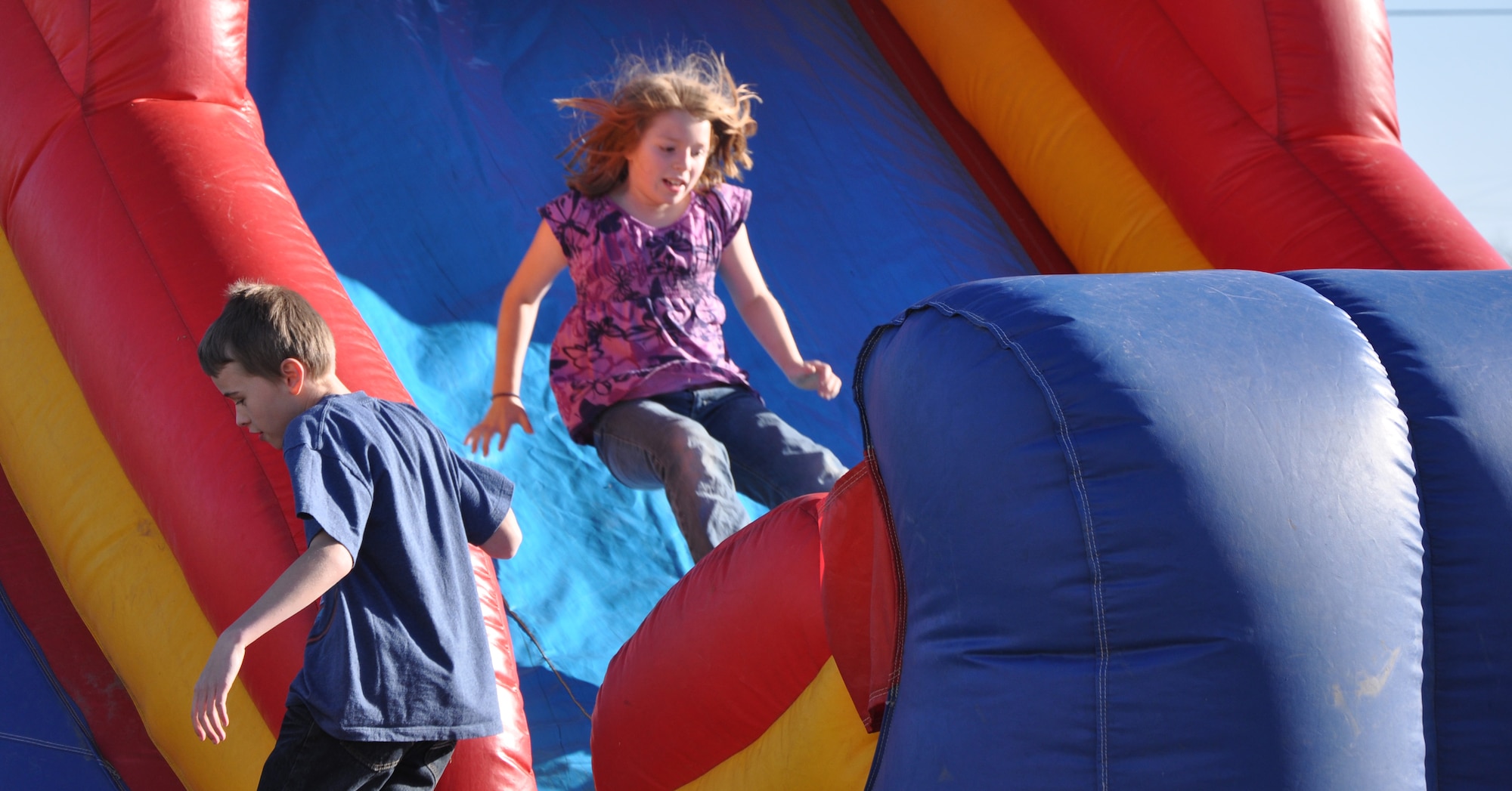 GOODFELLOW AIR FORCE BASE, Texas—A child bounces her way down the final leg of an obstacle course during the fifth annual Kids’ Fun Day at the Little League  baseball field, Feb. 8. Hosted by the Youth Center, the event promotes children’s health and nutrition. (U.S. Air Force photo/Airman Jessica Keith) 