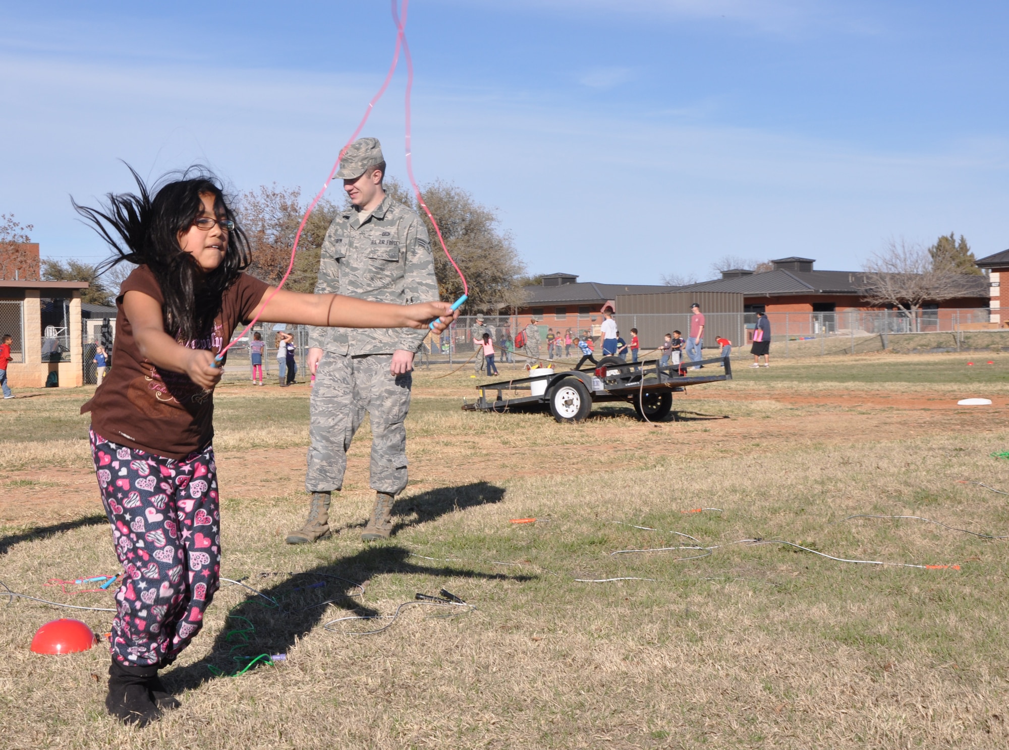 GOODFELLOW AIR FORCE BASE, Texas—Children jump rope during one of the stations at the fifth annual Kids’ Fun Day at the Little League baseball field, Feb. 8. More than 100 youths participated in the health awareness event. (U.S. Air Force photo/Airman Jessica Keith)