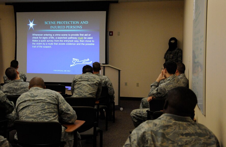 Airmen assigned to the 2nd Security Forces Squadron attend a briefing detailing what to do upon arrival to a crime scene on Barksdale Air Force Base, La., Feb. 11. The briefing ranged from proper security of the scene to determining the status of injured personnel. (U.S. Air Force photo/Airman 1st Class Andrew Moua)