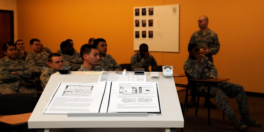 Airmen assigned to the 2nd Security Forces Squadron attend a briefing detailing the proper procedures to secure a crime scene on Barksdale Air Force Base, La., Feb. 11. The briefing was a refresher course on policies to prevent contamination of evidence. (U.S. Air Force photo/Airman 1st Class Andrew Moua)