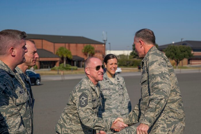 Maj. Gen. William J. Bender, U.S. Air Force Expeditionary Center commander, Joint Base McGuire-Dix-Lakehurst, N.J., greets Chief Master Sgt. Earl Hannon, 628th Air Base Wing command chief, during a visit Feb. 6, 2013, at Joint Base Charleston - Air Base, S.C. General Bender was visiting JB Charleston as one of several site visits to see the missions and units aligned under the Expeditionary Center administratively. The EC provides administrative control for six wings and two groups within Air Mobility Command, to include the 628th Air Base Wing at Joint Base Charleston, S.C. (U.S. Air Force photo/ Senior Airman George Goslin)