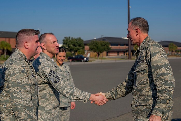 Maj. Gen. William J. Bender, U.S. Air Force Expeditionary Center commander, Joint Base McGuire-Dix-Lakehurst, N.J., greets Chief Master Sgt. Larry Williams, 437th Airlift Wing command chief, during a visit Feb. 6, 2013, at Joint Base Charleston - Air Base, S.C. General Bender was visiting JB Charleston as one of several site visits to see the missions and units aligned under the Expeditionary Center administratively. The EC provides administrative control for six wings and two groups within Air Mobility Command, to include the 628th Air Base Wing at Joint Base Charleston, S.C. (U.S. Air Force photo/ Senior Airman George Goslin)