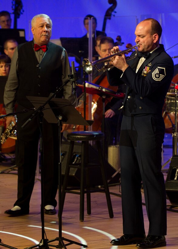 Master Sgt. Rich Sigler, Airmen of Note trumpeter, performs a solo alongside Paquito D’Rivera, 11-time Grammy Award winner and Latin Jazz musician, during a Guest Artist Series concert Feb. 10, 2013 in Washington, D.C. This was the first of three concerts in the 2013 Guest Artist Concert series, which will feature guest artists “The Rogues,” a Scotish/Celtic rock band, on Feb. 24, and country music sensation Lee Greenwood on Mar. 10. (U.S. Air Force photo/Senior Airman Bahja Joi Jones) 