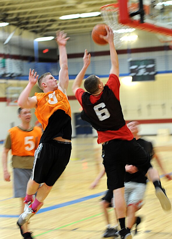 Airman 1st Class Austin Payne, 28th Force Support Squadron fitness specialist, jumps to block a layup during the 2013 Intramural Basketball League tournament in the Bellamy Fitness Center at Ellsworth Air Force Base, S.D., Feb. 5, 2013. The 28th FSS squared off against a strong 28th Civil Engineer Squadron (A) team. The CES squad used a stingy defensive scheme and strong ball movement to take the win, 67-27. (U.S. Air Force photo by Airman 1st Class Hrair H. Palyan/Released)

