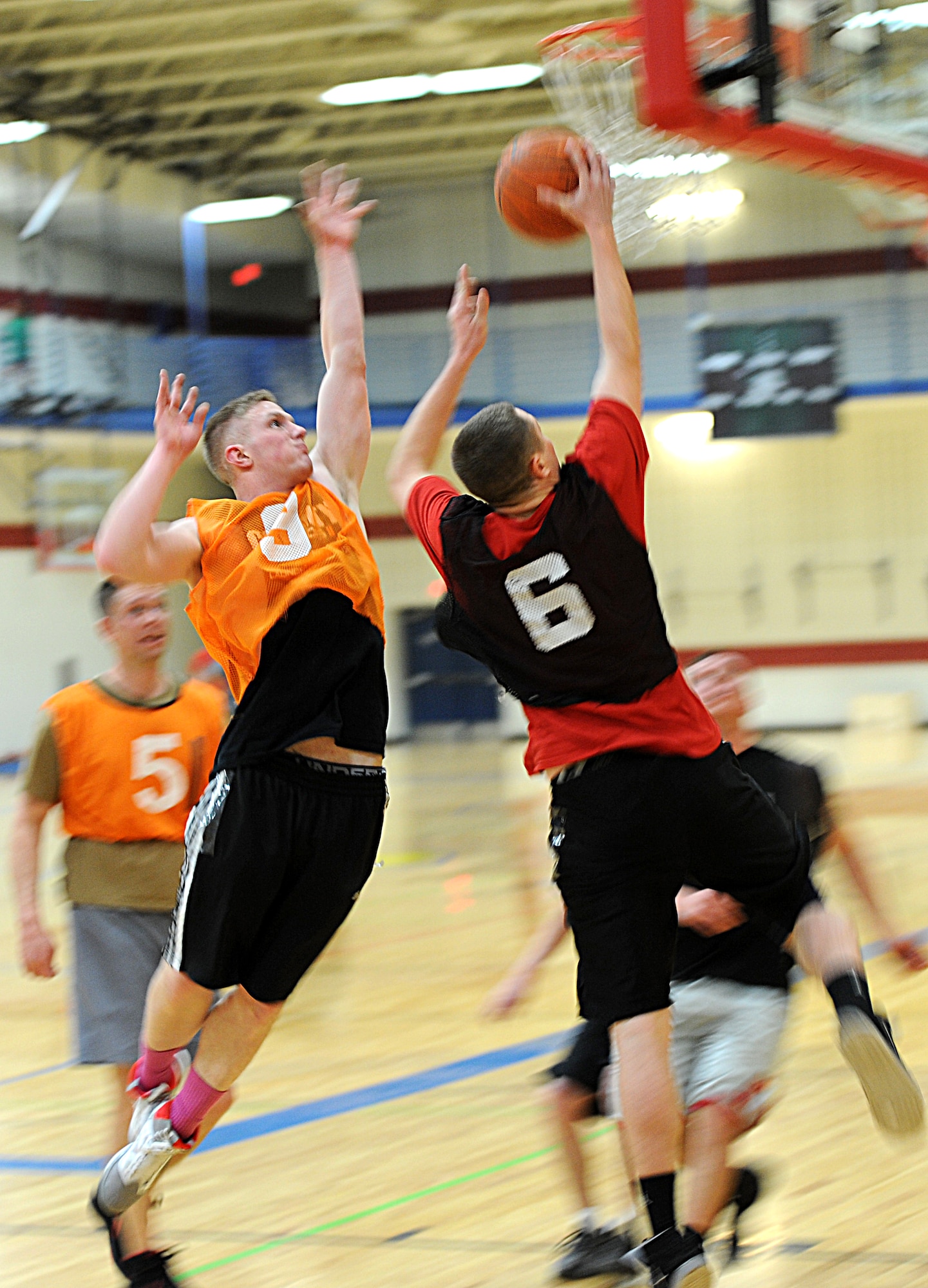 Airman 1st Class Austin Payne, 28th Force Support Squadron fitness specialist, jumps to block a layup during the 2013 Intramural Basketball League tournament in the Bellamy Fitness Center at Ellsworth Air Force Base, S.D., Feb. 5, 2013. The 28th FSS squared off against a strong 28th Civil Engineer Squadron (A) team. The CES squad used a stingy defensive scheme and strong ball movement to take the win, 67-27. (U.S. Air Force photo by Airman 1st Class Hrair H. Palyan/Released)
