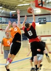 Airman 1st Class Austin Payne, 28th Force Support Squadron fitness specialist, jumps to block a layup during the 2013 Intramural Basketball League tournament in the Bellamy Fitness Center at Ellsworth Air Force Base, S.D., Feb. 5, 2013. The 28th FSS squared off against a strong 28th Civil Engineer Squadron (A) team. The CES squad used a stingy defensive scheme and strong ball movement to take the win, 67-27. (U.S. Air Force photo by Airman 1st Class Hrair H. Palyan/Released)
