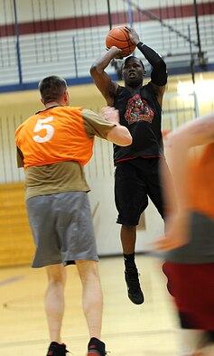 Senior Airman Irving Adams, 28th Civil Engineer Squadron Fire and Emergency Services driver and operator, pulls up for a jumper during the 2013 Intramural Basketball League tournament in the Bellamy Fitness Center at Ellsworth Air Force Base, S.D., Feb. 5, 2013. Games are scheduled Monday through Friday from 5 to 8 p.m. and will continue until March 16. (U.S. Air Force photo by Airman 1st Class Hrair H. Palyan/Released)