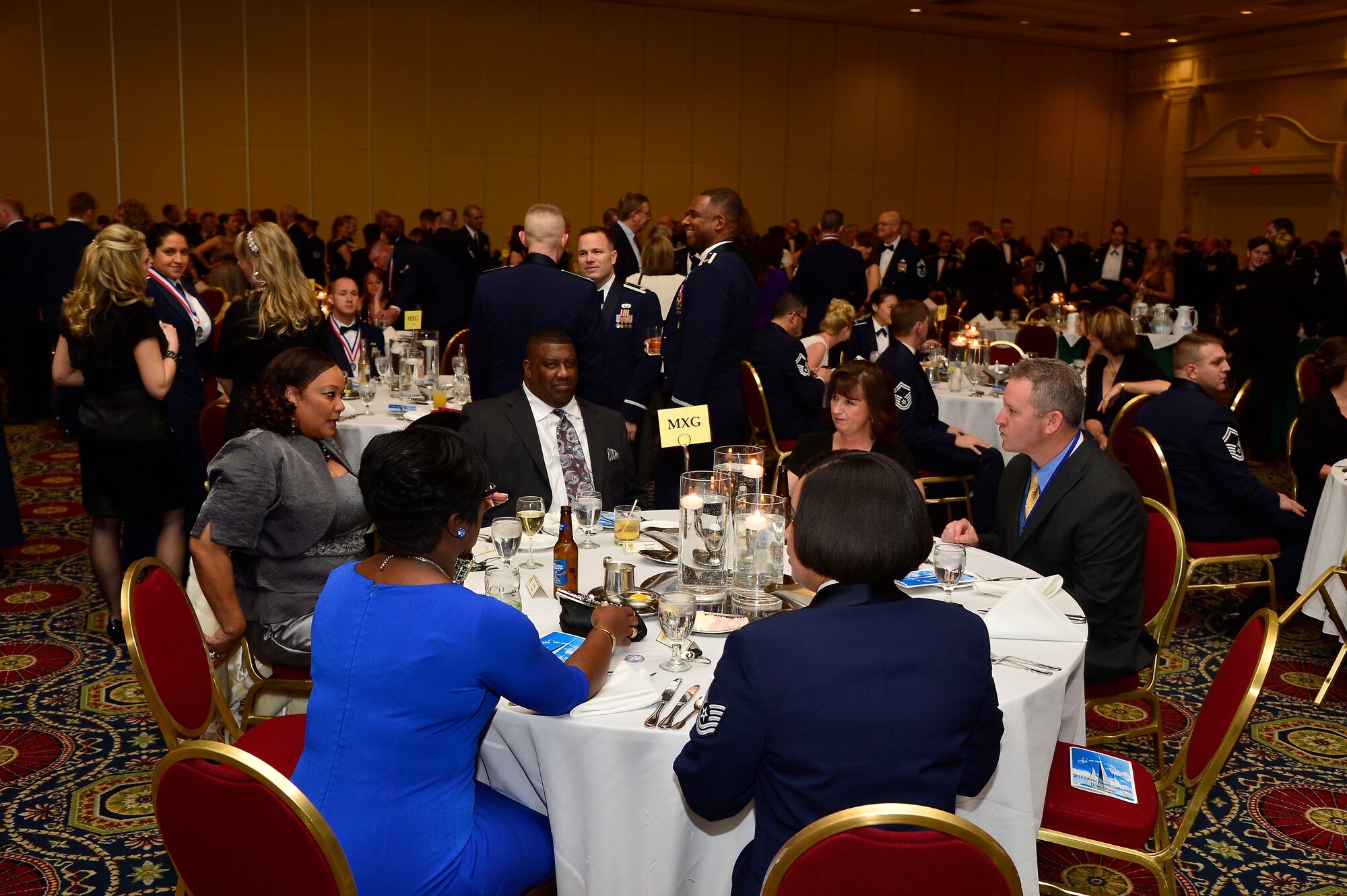 Members of the 436th Maintenance Group socialize at their table prior to the commencement of ceremonies at 2012 436 AW Annual Awards Ceremony, held Feb 8, 2013 at Dover Downs Hotel Casino Dover Del. U.S. Air Force photo/David S. Tucker