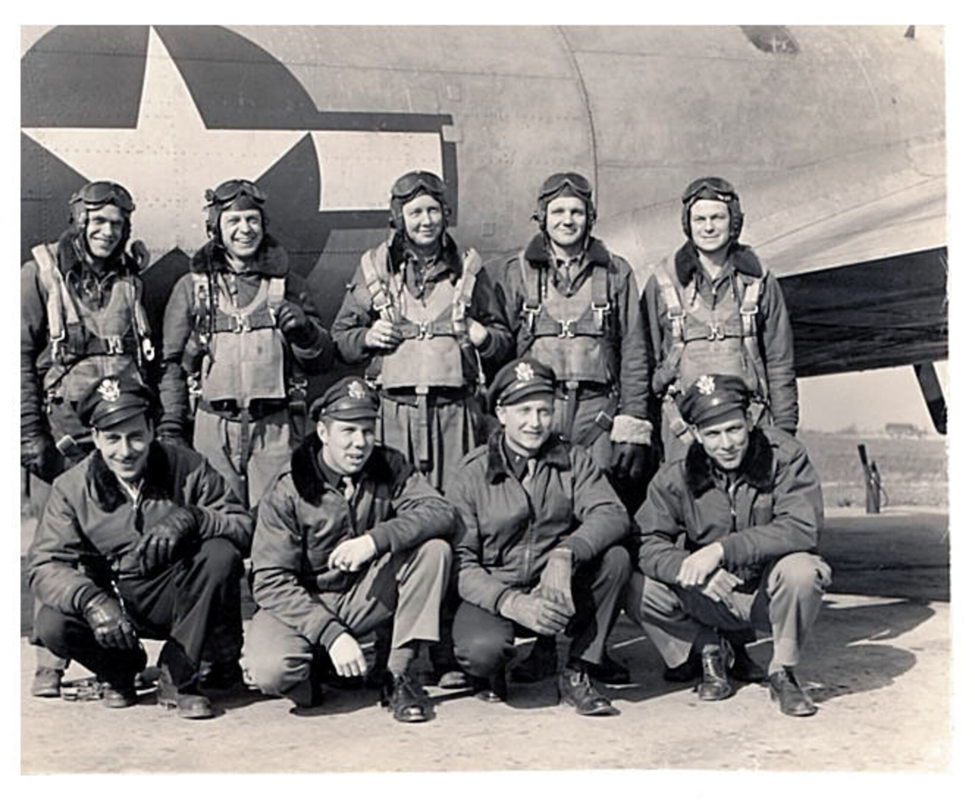 Adrian Marlin, back row, center, poses with his aircrew in a photo taken during World War II.  Marlin served as a tail gunner on a B-17 Flying Fortress during the war.  He and his aircrew survived a crash landing in 1944.  Marlin was recognized and honored for his service by the Air Force Reserve 931st Air Refueling Group, McConnell Air Force Base, Kan., during the unit's annual award banquet, Feb. 9, 2013.  (Courtesy photo)
