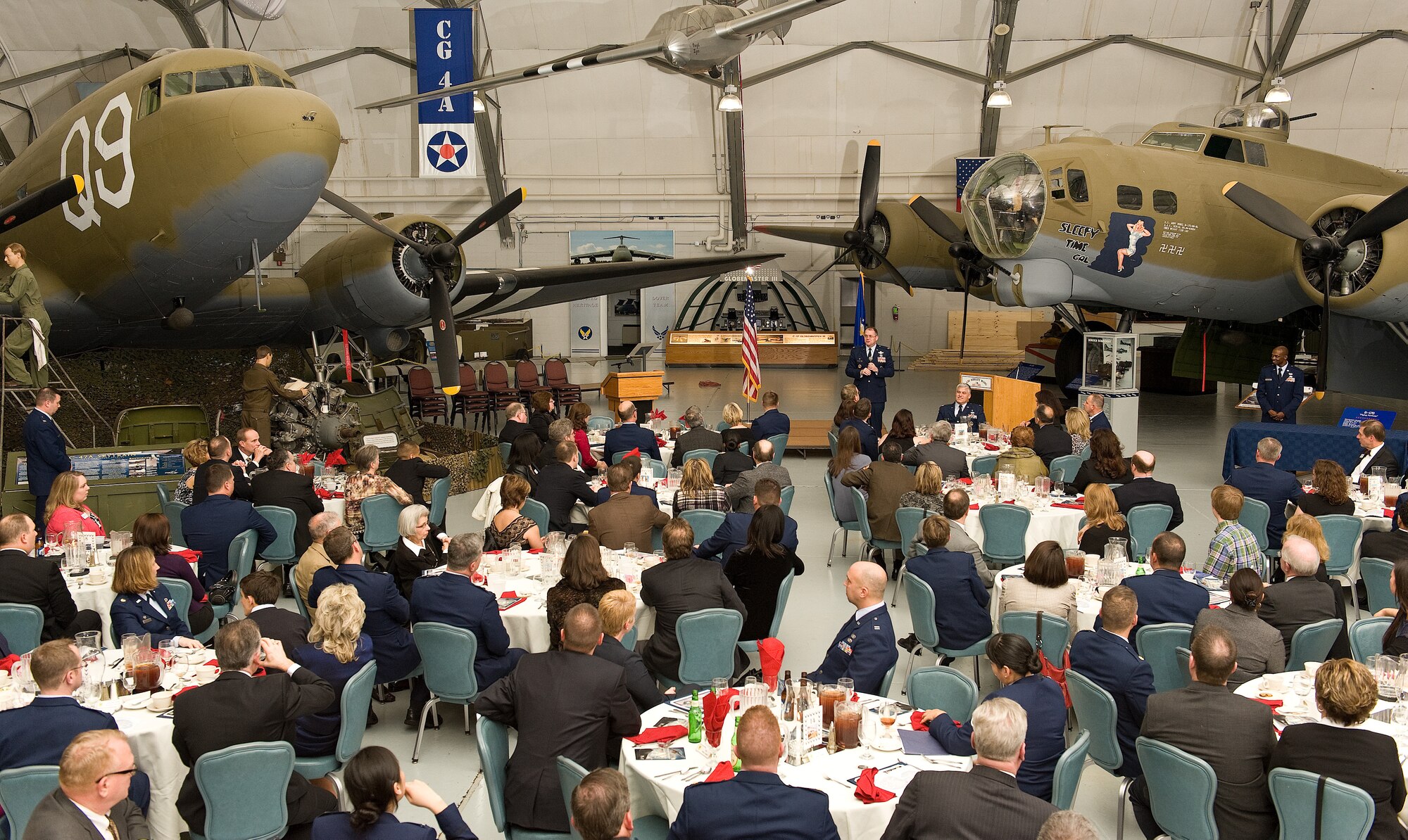 Commanders from the 436th and 512th Airlift Wings, Air Force Mortuary Affairs Operations, Armed Forces Medical Examiner System, and Joint Personal Effects Depot recognize outgoing 2012 Honorary Commanders and induct new local community leaders during the 2013 Honorary Commander Induction Ceremony Feb. 9, 2013, at the Air Mobility Command Museum, Dover Air Force Base, Del. 2012 Honorary Commanders were inducted as Honorary Commander Alumni. The honorary commander program, which began at Dover AFB in 1992, matches civic leaders with active-duty and reserve military commanders to help community members understand the importance of Dover AFB's mission while allowing military commanders and units to learn more about the community in which they live. (U.S. Air Force photo/Roland Balik)