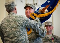 Former 919th Special Operations Wing commander, Brig. Gen. Jon Weeks accepts the Air Force Special Operations Air Warfare Center guidon as its first leader at an activation ceremony at Duke Field, Fla., Feb. 11.  The new center is Weeks’ third special operations command.  The AFSOAWC will combine the efforts of units across AFSOC that work with doctrine development, education, training and execution of the command’s irregular warfare capabilities.  The center will bring together more than 500 active-duty and reserve Airmen through total force integration.  (U.S. Air Force photo/Tech. Sgt. Samuel King Jr.)