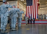 Air Force Special Operations Command Airmen and leadership salute the flag during the National Anthem at the Air Force Special Operations Air Warfare Center activation ceremony at Duke Field, Fla., Feb. 11.  Former 919th Special Operations Wing commander, Brig. Gen. Jon Weeks assumed command of the center.  The AFSOAWC will combine the efforts of units across AFSOC that work with doctrine development, education, training and execution of the command’s irregular warfare capabilities. The center will bring together more than 500 active-duty and reserve Airmen through total force integration.   (U.S. Air Force photo/Tech. Sgt. Samuel King Jr.)