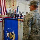 Chief Master Sgt. Tyler Outten, of the 919th Special Operations Wing, holds the wing guidon as the colors are brought in during the activation ceremony of the Air Force Special Operations Air Warfare Center at Duke Field, Feb. 11.  Former 919th Special Operations Wing commander, Brig. Gen. Jon Weeks assumed command of the center.  The AFSOAWC will combine the efforts of units across AFSOC that work with doctrine development, education, training and execution of the command’s irregular warfare capabilities. The center will bring together more than 500 active-duty and reserve Airmen through total force integration.   (U.S. Air Force photo/Tech. Sgt. Samuel King Jr.)