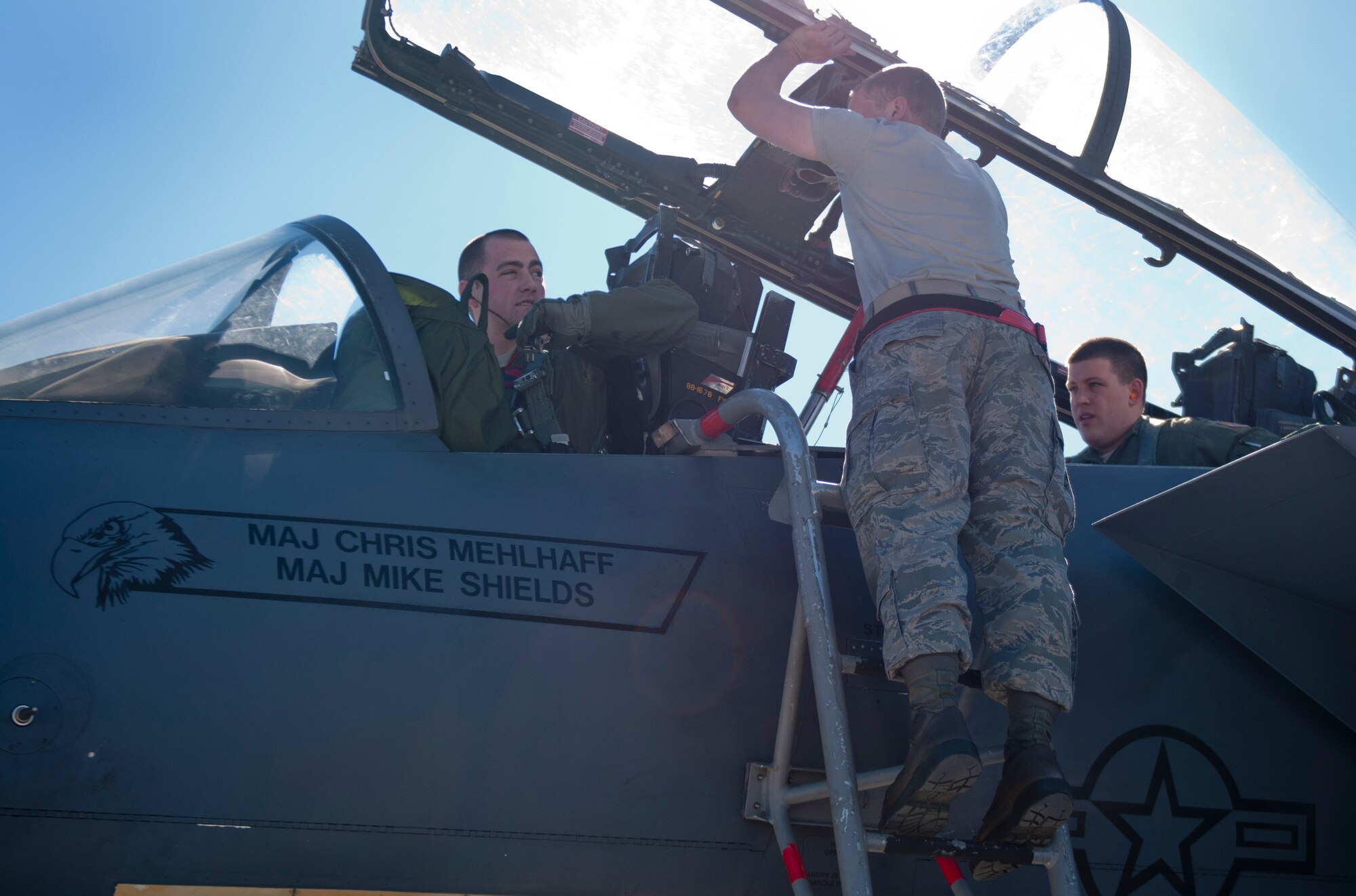 U.S. Air Force Airman 1st Class Justin Brant, 389th Aircraft Maintenance Unit crew chief performs pre-flight preparation on an F-15E Strike Eagle Feb. 1, 2013, at Nellis Air Force Base, Nev. High morale, trust, working well together and strong unity are important for the T-Bolts during exercises . (U.S. Air Force photo/Senior Airman Heather Hayward)