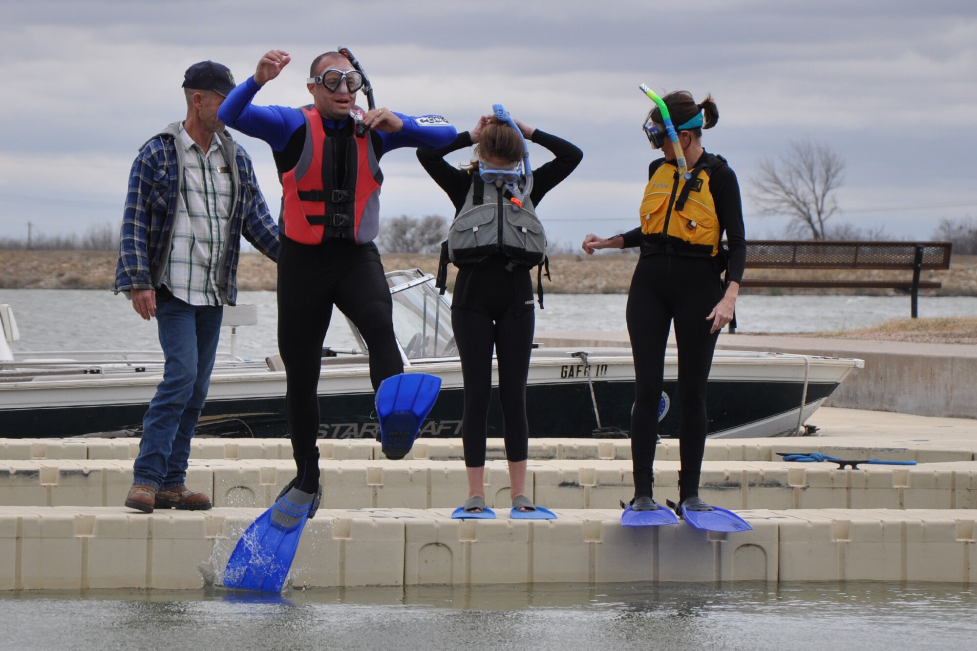 SAN ANGELO, Texas – Col. Mark Damiano, 17th Training Wing Commander, jumps in the 46-degree water of Lake Nasworthy to kick off the 2013 Goodfellow Outdoor Recreation Camp Polar Bear Plunge, Feb. 9. Damiano, along with his wife and daughter, were the first plungers this year. (U.S. Air Force photo/ Staff Sgt. Robert Smith)