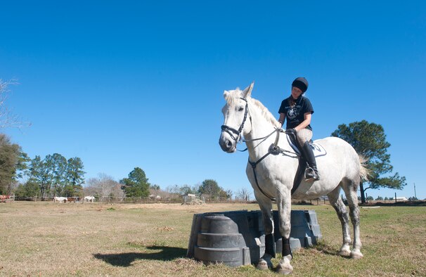 U.S. Air Force Staff Sgt. Stacey Chastain, 23d Wing Judge Advocate military justice paralegal, sits on her horse, Klein, outside a stable in Valdosta, Ga., Feb. 3, 2013. Chastain said being out in the countryside with her horse is relaxing. (U.S. Air Force photo by Senior Airman Jarrod Grammel/Released)
