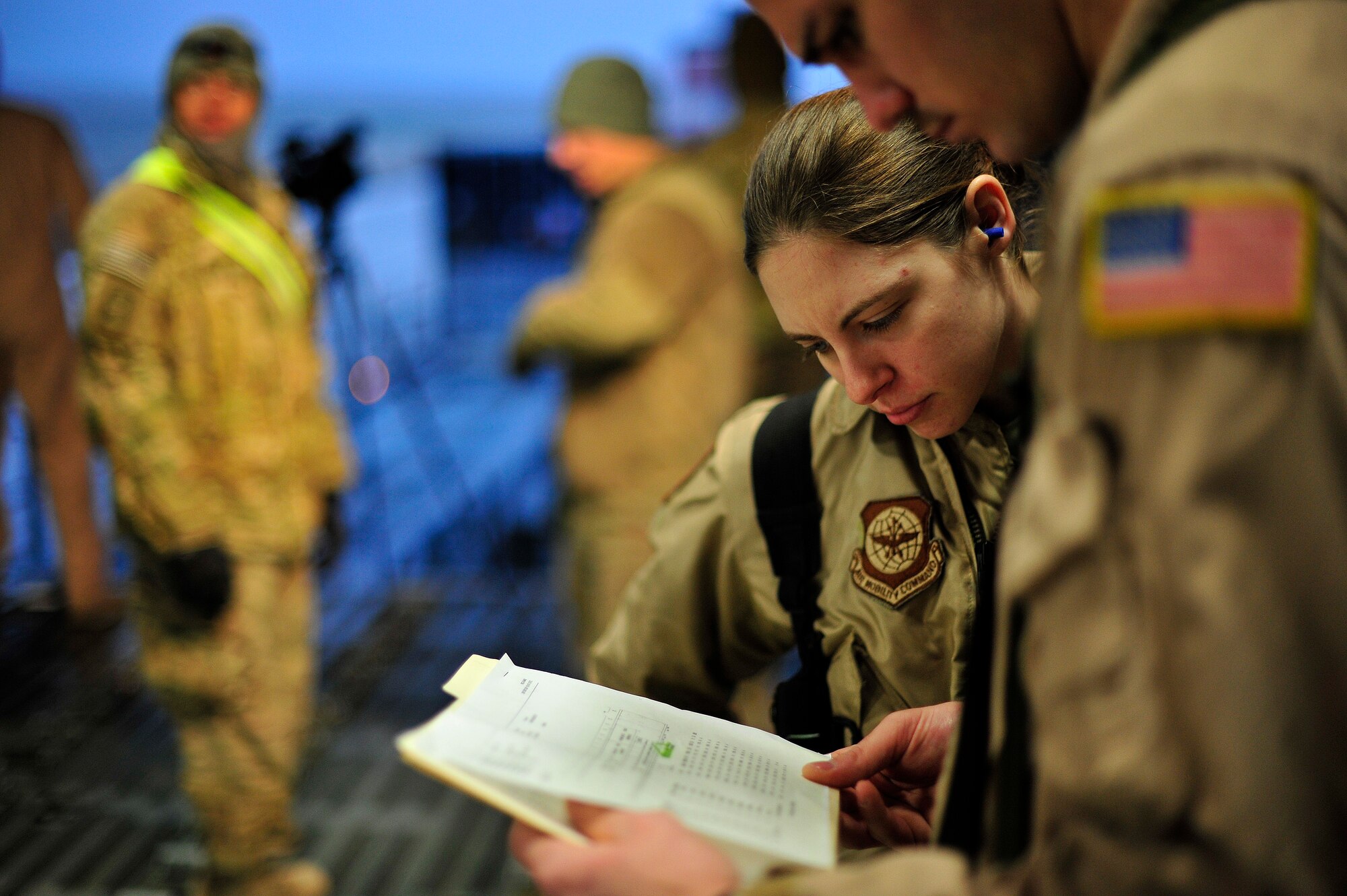 CAMP MARMAL, Afghanistan – U.S. Force Airman 1st Class Kayla Russell, a C-5M Super Galaxy loadmaster with the 436th Airlift Wing at Dover AFB, Del., inspects an aircraft load plan here Jan. 27, 2013. The 621st sent a contingency response team to Mazar-e-sharif Afghanistan to provide en-route command and control and communications support in support of a U.S. transportation command intermodal movement of two U.S. Army Combat Aviation Brigades. (U.S. Air Force photo by Tech Sgt. Parker Gyokeres)