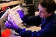 Airman 1st Class Kayla Adams, 779th Medical Group medical laboratory technician, reads a specimen plate under a fluorescent light Jan. 31, 2013 at Joint Base Andrews, Md. The results of the readings are used to diagnose various types of bacterial infections. (U.S. Air Force photo/ Airman 1st Class Erin O’Shea)               