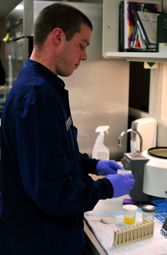 Airman 1st Class Jacob Hatcher, 779th Medical Group medical laboratory technician, performs an automated urinalysis test on Jan. 31, 2013 at Joint Base Andrews, Md. This test is used to detect and diagnose urinary tract infections. (U.S. Air Force photo/Airman 1st Class Erin O’Shea)   