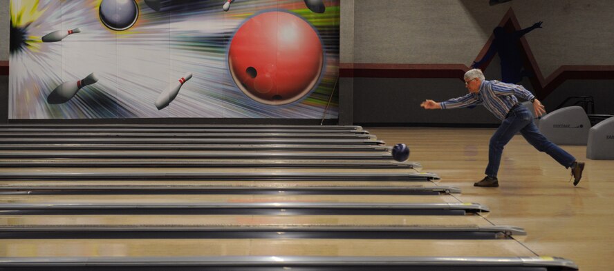 Retired Maj. Don Nelsen lets go of his bowling ball at the Barksdale Lanes on Barksdale Air Force Base, La., Feb. 11. The Barksdale bowling center offers regular bowling games as well as leagues and tournaments. (U.S. Air Force photo/Airman 1st Class Benjamin Gonsier)