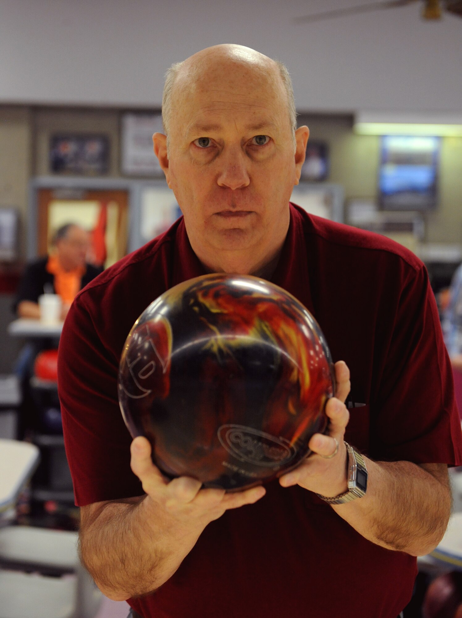 Retired Maj. Loren Aguillard, a former B-52H Stratofortress radar navigator, sets up his shot at the Barksdale Lanes on Barksdale Air Force Base, La., Feb. 11. The bowling center sells and rents out the latest equipment including shoes, bags and bowling balls. (U.S. Air Force photo/Airman 1st Class Benjamin Gonsier)
