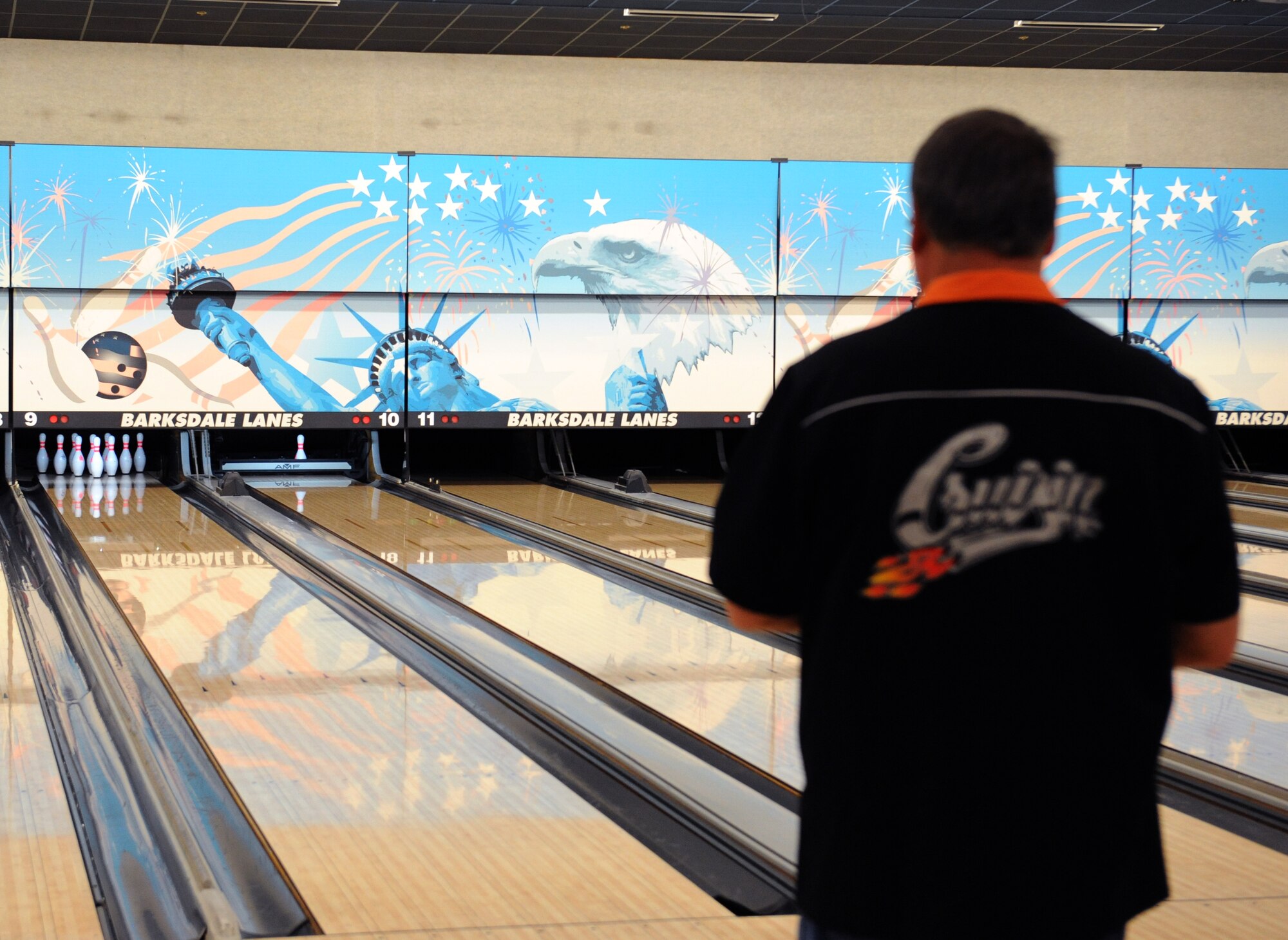 Doug Nurdin sets up his shot at the Barksdale Lanes on Barksdale Air Force Base, La., Feb. 11. Barksdale Lanes is open seven days a week to Team Barksdale and retirees in the local community. The bowling center hosts events for birthday parties, retirees, spouses and single Airmen. (U.S. Air Force photo/Airman 1st Class Benjamin Gonsier)
