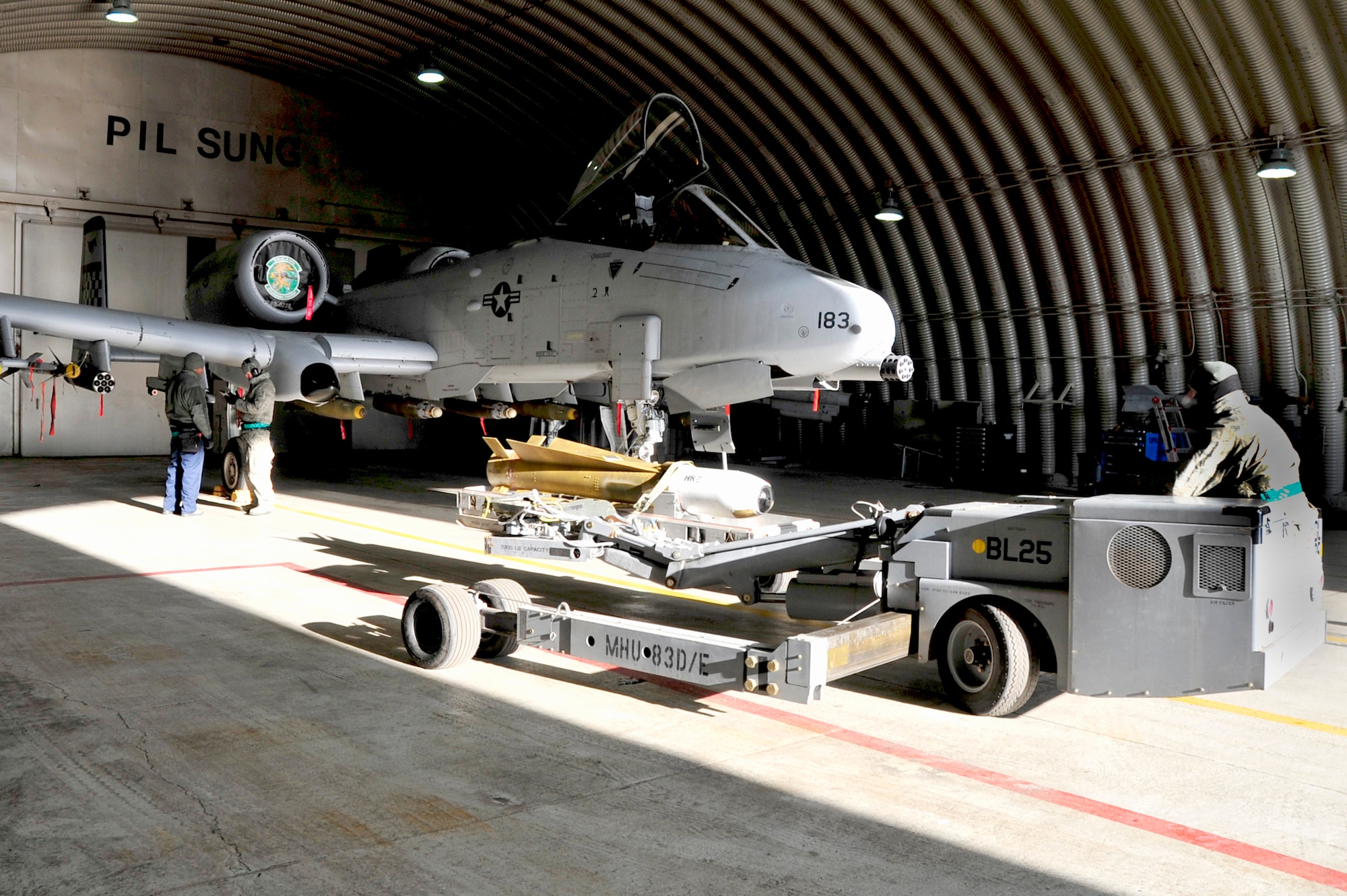 Weapons loaders with the 25thFighter Squadron connect an AGM-65 Maverick to an A-10 Thunderbolt II in preparation for operational readiness exercise Beverly Bulldog 13-02 at Osan Air Base, Republic of Korea, Feb. 8, 2013. The AGM-65 Maverick is a tactical, air-to-surface guided missile designed for close air support, interdiction and defense suppression mission. It provides stand-off capability and high probability of strike against a wide range of tactical targets, including armor, air defenses, ships, transportation equipment and fuel storage facilities. (U.S. Air Force photo/Airman 1st Class Alexis Siekert)
