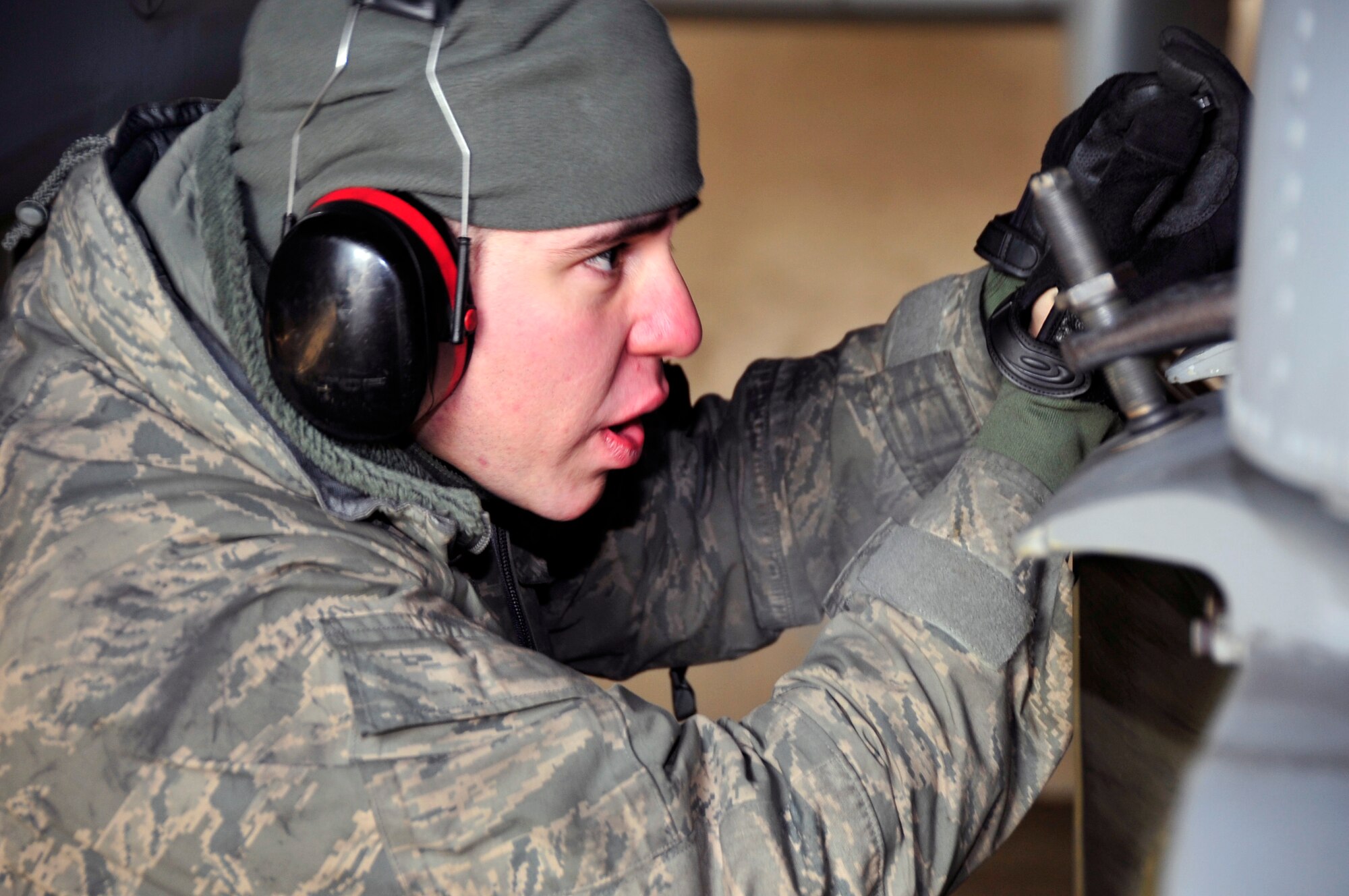 Staff Sgt. Angel Dearce, 25th Fighter Squadron weapons load crew chief, connects an air-to-ground tactical missile known as an  AGM-65 Maverick to an A-10 Thunderbolt II in preparation for operational readiness exercise Beverly Bulldog 13-02 at Osan Air Base, Republic of Korea, Feb. 8, 2013. Exercises such as BB 13-02 test Osan Airmen’s abilities during a heightened state of readiness while providing combat ready forces for close air support, air strike control, counter air, interdiction, theater airlift, and communications in the defense of the Republic of Korea. (U.S. Air Force photo/Airman 1st Class Alexis Siekert)
