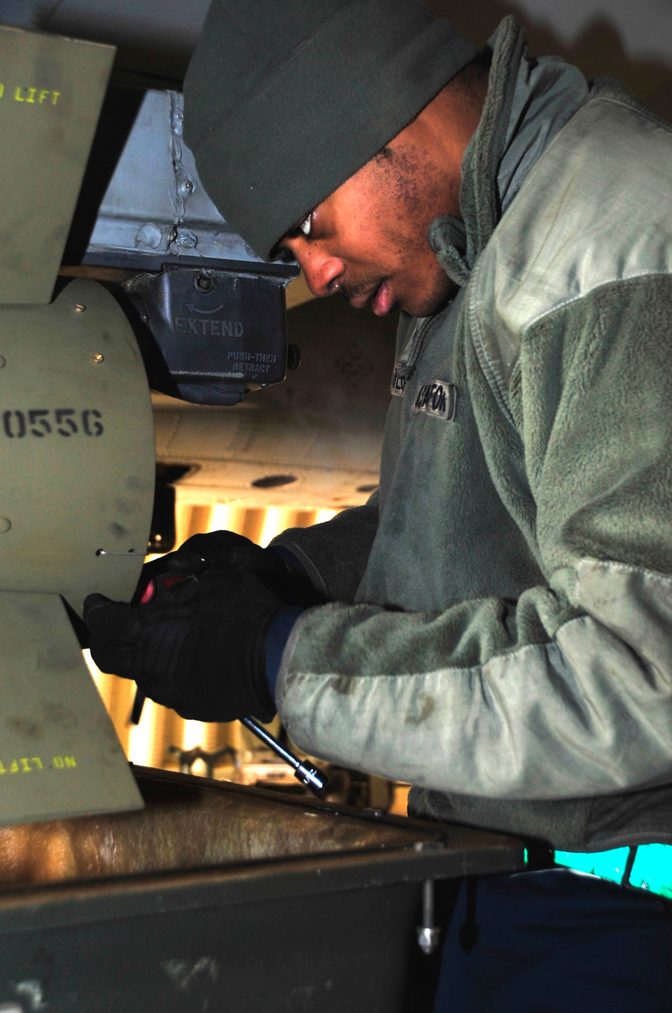 Senior Airman James Taylor, 25th Fighter Squadron weapons load crew member, connects an air-to-ground tactical missile known as an AGM-65 Maverick to an A-10 Thunderbolt II at Osan Air Base, Republic of Korea, Feb. 8, 2013. The load crew demonstrated their weapons loading capabilities in preparation for operational readiness exercise Beverly Bulldog 13-02. (U.S. Air Force photo/Airman 1st Class Alexis Siekert)