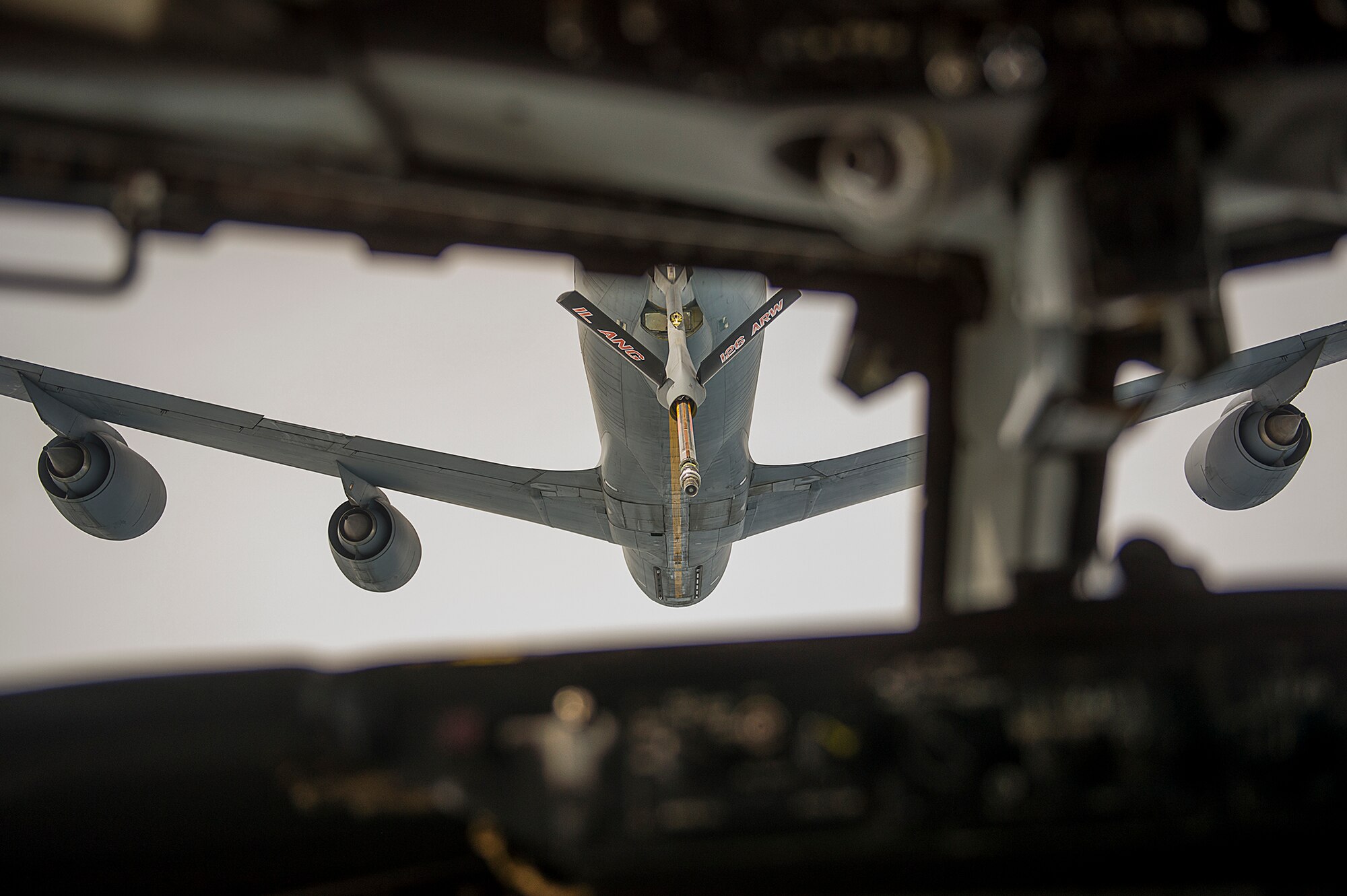 A U.S. Air Force KC-10 Extender flies into position so that an E-3 Sentry, Airborne Warning and Control System, can receive fuel during an in-flight refueling over an undisclosed location, Southwest Asia, Jan. 30, 2013. The KC-10 incorporates military-specific equipment for its primary roles of transport and aerial refueling. (U.S. Air Force photo/Tech. Sgt. Dennis J. Henry Jr.)
