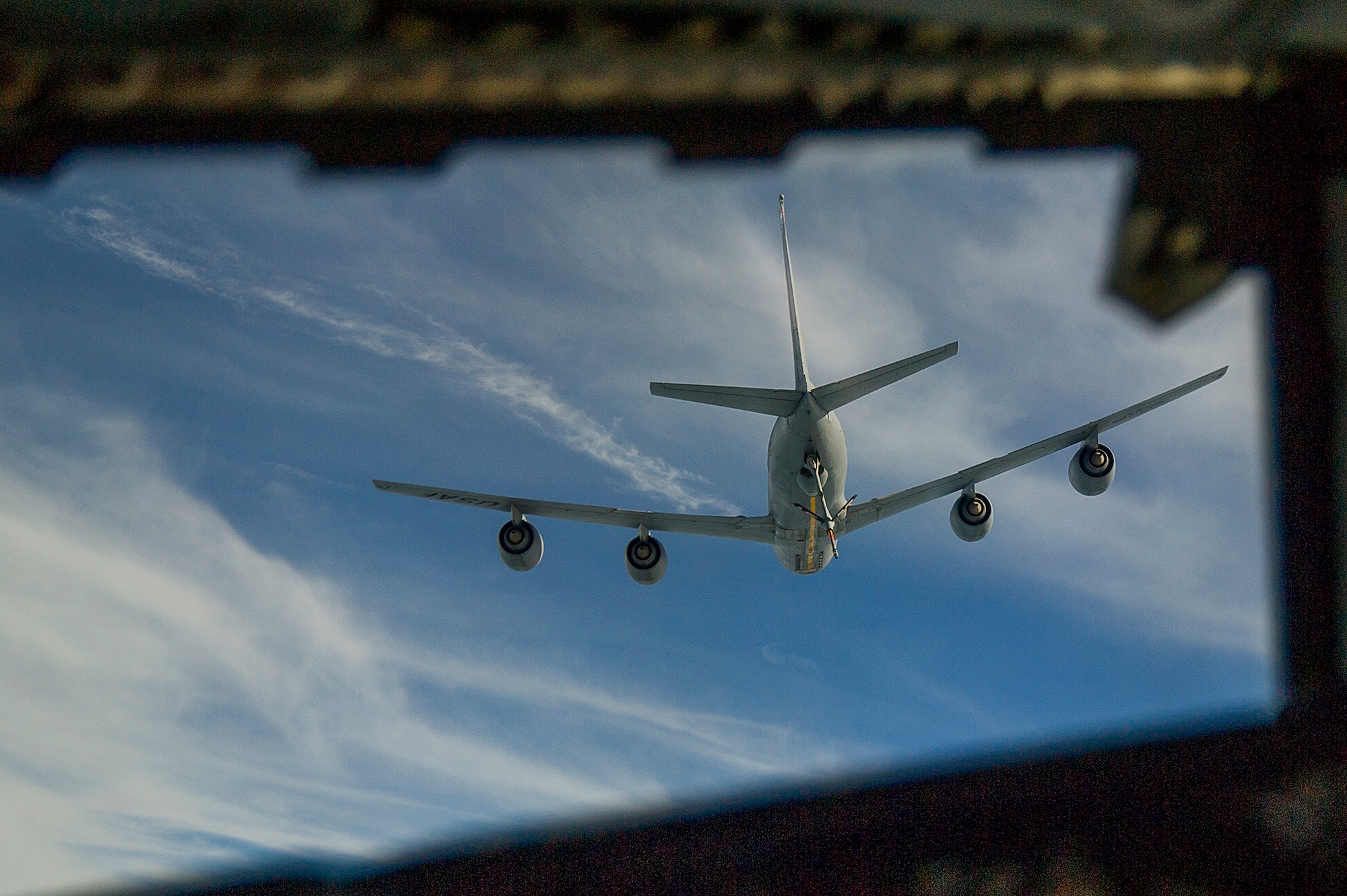 U.S. Air Force KC-10 Extender flies into position so that an E-3 Sentry, Airborne Warning and Control System, can receive fuel during an in-flight refueling over an undisclosed location, Southwest Asia, Jan. 30, 2013. The KC-10 incorporates military-specific equipment for its primary roles of transport and aerial refueling. (U.S. Air Force photo/Tech. Sgt. Dennis J. Henry Jr.)