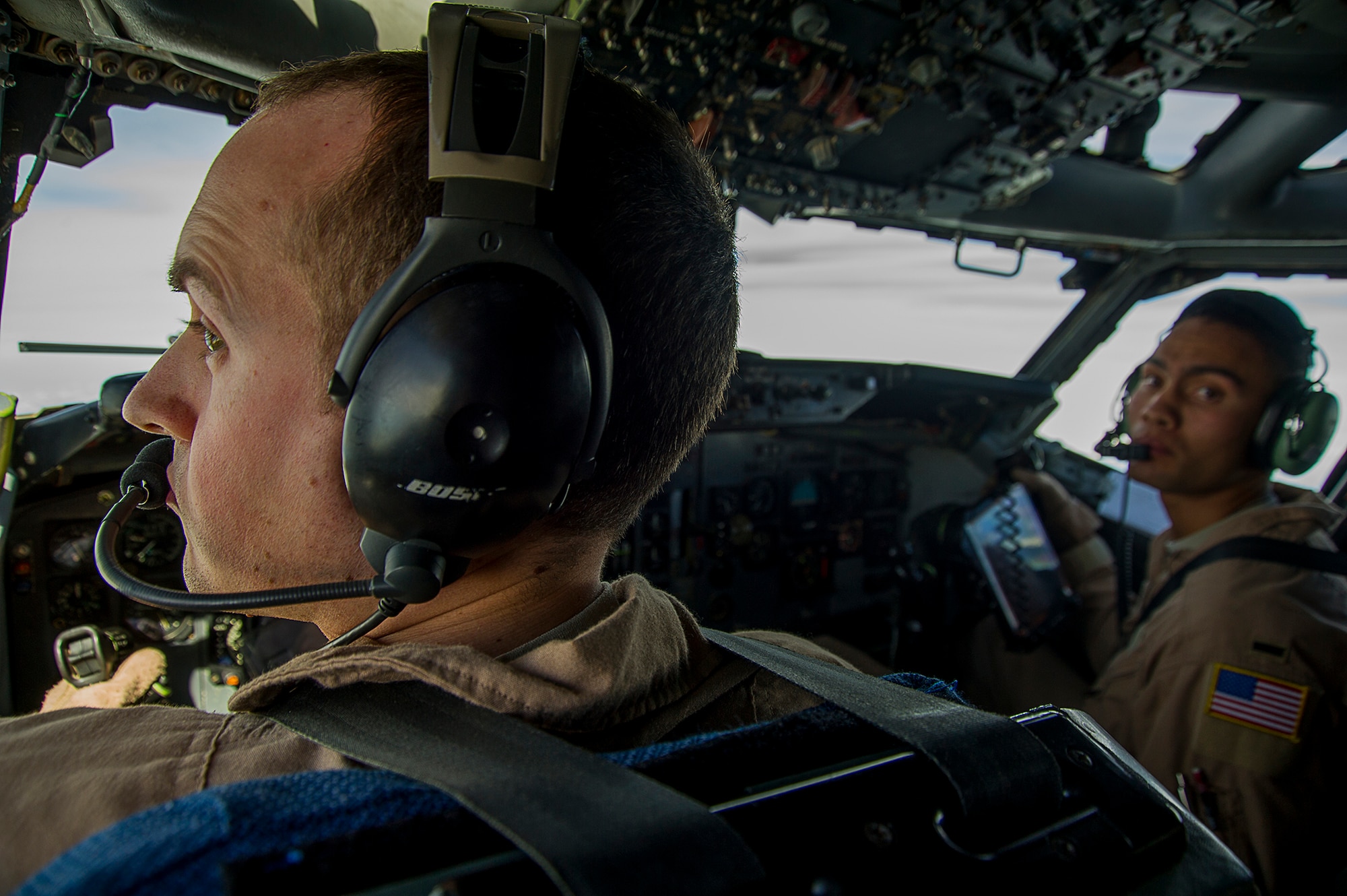 U.S. Air Force Capt. Christopher Lien, a pilot, and 1st Lt. Seth Woolcott, a copilot, for the E-3 Sentry, Airborne Warning and Control System, from the 963rd Expeditionary Airborne Air Control Squadron, accomplish a combat support mission over an undisclosed location, Southwest Asia, Jan. 30, 2013. The E-3 Sentry is an aircraft with an integrated command and control battle management, or C2BM, surveillance, target detection, and tracking platform. Lien and Woolcott are from the 964th Airborne Air Control Squadron which is part of the 552d Air Control Wing at Tinker Air Force Base, Oklahoma. (U.S. Air Force photo/Tech. Sgt. Dennis J. Henry Jr.)