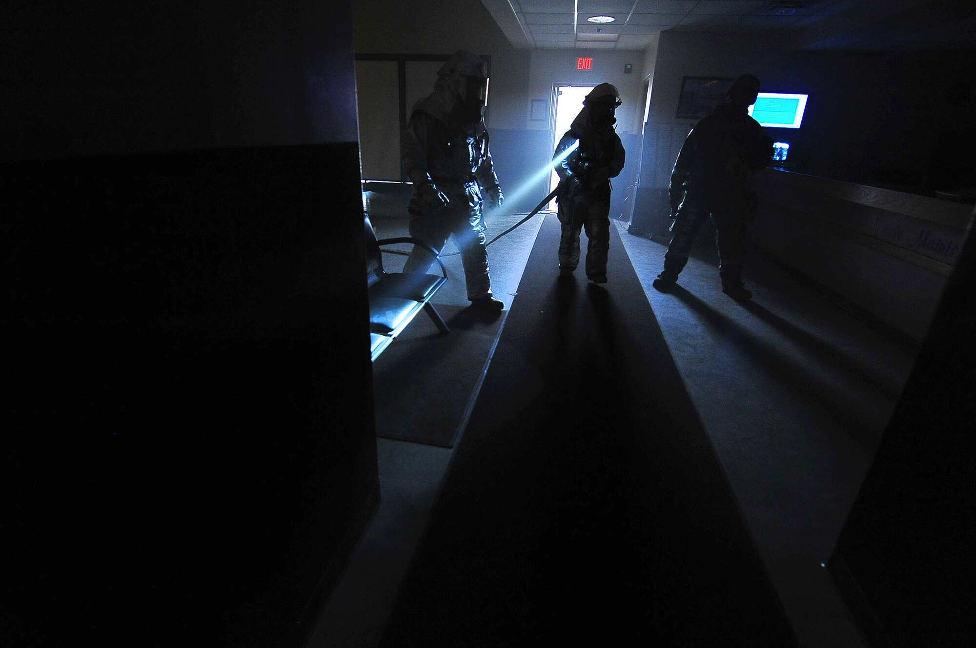 Fire fighters from the 51st Civil Engineer Squadron clear a building and extinguish simulated fires during a training scenario for an operational readiness exercise, Beverly Bulldog 13-02, at Osan Air Base, Republic of Korea, Feb. 12, 2013. These types of exercises help Airmen train in a heightened state of readiness in order to provide combat ready forces for close air support, air strike control, counter air, interdiction, theater airlift, and communications in the defense of the Republic of Korea. (U.S. Air Force photo/Staff Sgt. Sara Csurilla)