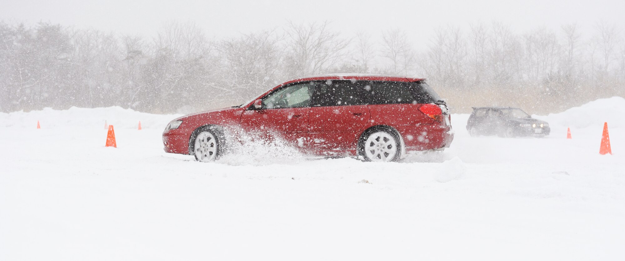 A Slippery Weasel driving instructor demonstrates how to drive in snow at Misawa Air Base, Japan, Jan. 18, 2013. The Slippery Weasel Course is designed to help individuals who are not used to driving in snowy or icy conditions; however the course is open to anyone. There are two more classes being offered on Feb. 15 and March 1, from 9 to 11 a.m. (U.S. Air Force photo by Airman 1st Class Kia Atkins)